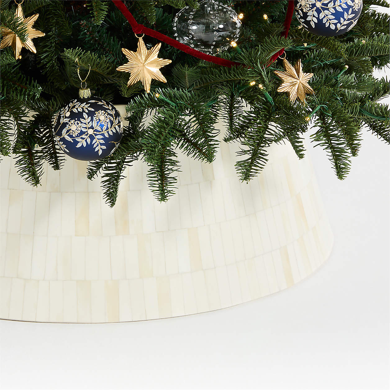 Natural Bone Inlay Christmas Tree Collar 27.5" | Crate & Barrel | Crate & Barrel
