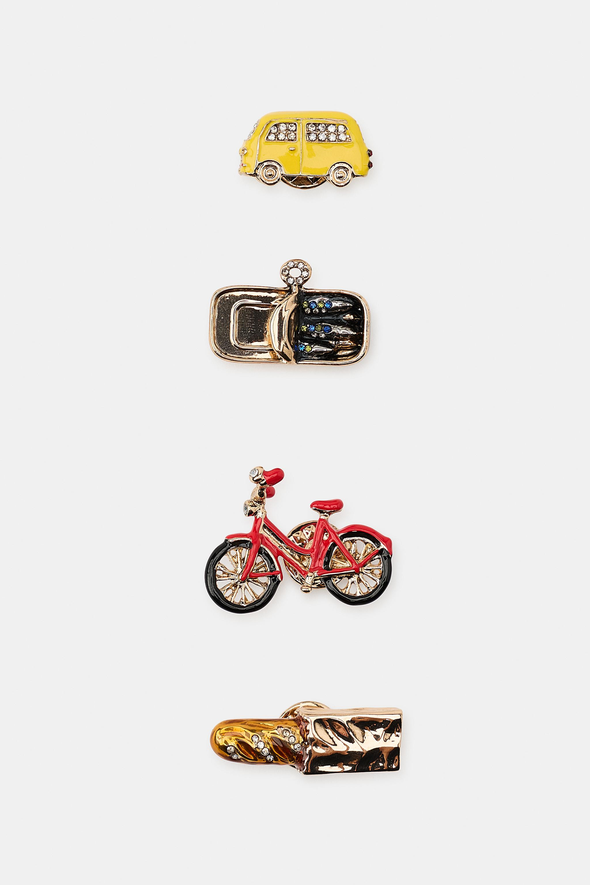 Pack of four pins in various shapes and sizes featuring colored resin pieces. Butterfly clutch cl... | Zara US