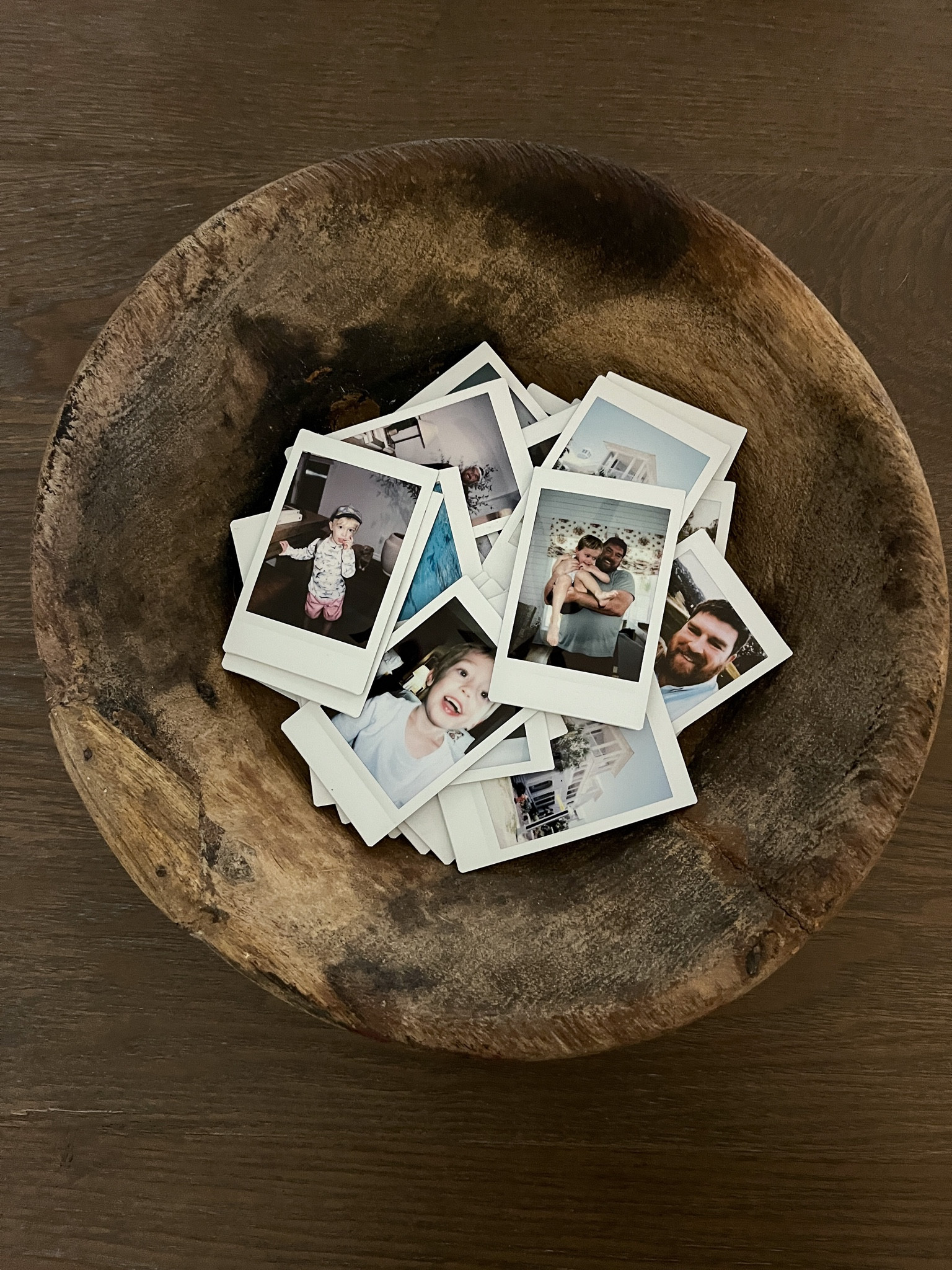 Polaroid picture display idea - reclaimed wooden bowl 

#LTKfamily #LTKhome #LTKstyletip