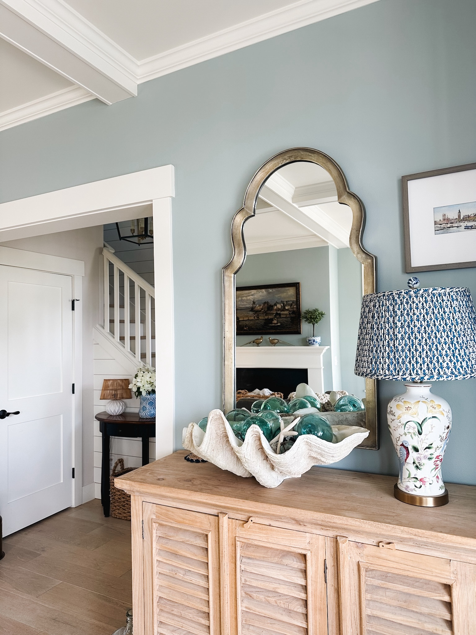 Pleated blue white lampshade, floral lamp, clam shell bowl, blue glass floats, arched curved mirror 

#LTKSeasonal #LTKSaleAlert #LTKHome