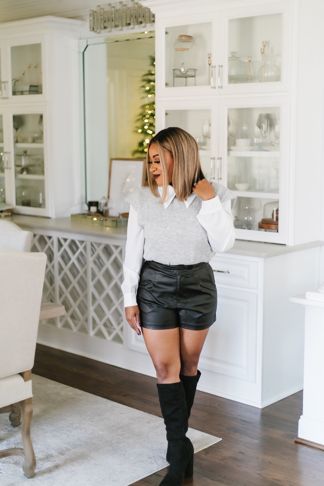 Holiday chic but make it effortless ✨
This outfit is giving casual holiday party, date night in December, and put-together without trying too hard. I love layering a cozy sweater vest over a crisp white top and dressing it up with boots and a leather mini — festive, comfy, and cute all at once.

Perfect for holiday dinners, parties, or just getting out feeling a little extra this season 🤍

#holidayoutfit #holidaystyle #winterfashion #holidayinspired #sweatervest #leatherminiskirt #winteroutfits #festivestyle #nitraabstyle