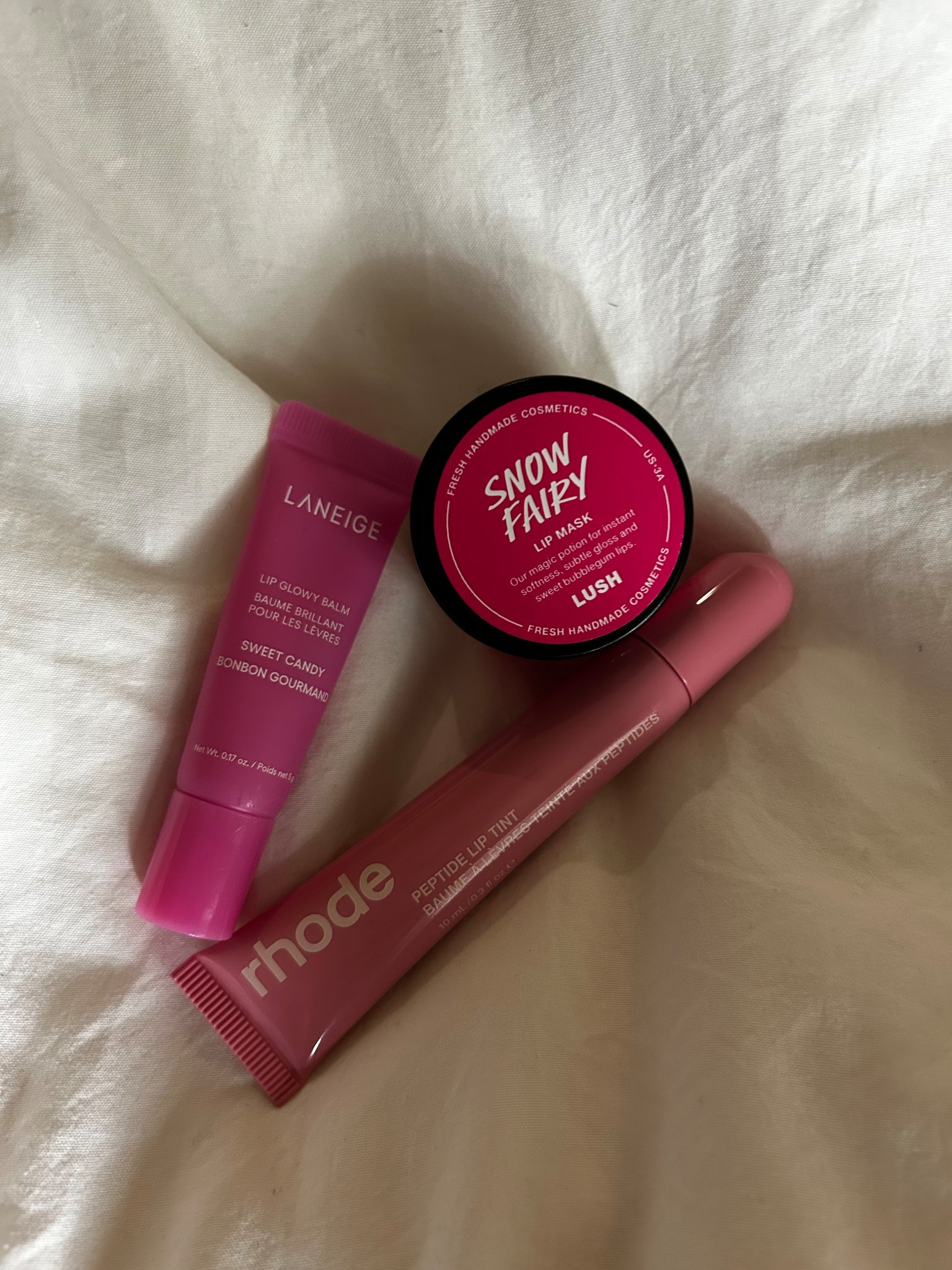 Favorite lippies right now!

The Laneige lip glowy balm in sweet candy is from the midnight minis set. 🍬 

Rhode peptide lip tint in ribbon 🎀 

I linked the lush snow fairy shower gel and body mist below, couldn’t find the lip mask but the scent is amazing! ❄️ 

Lip mask
Lip gloss
Lip balm 
Beauty gifts for her 

#LTKBeauty #LTKselfcare #LTKGiftGuide