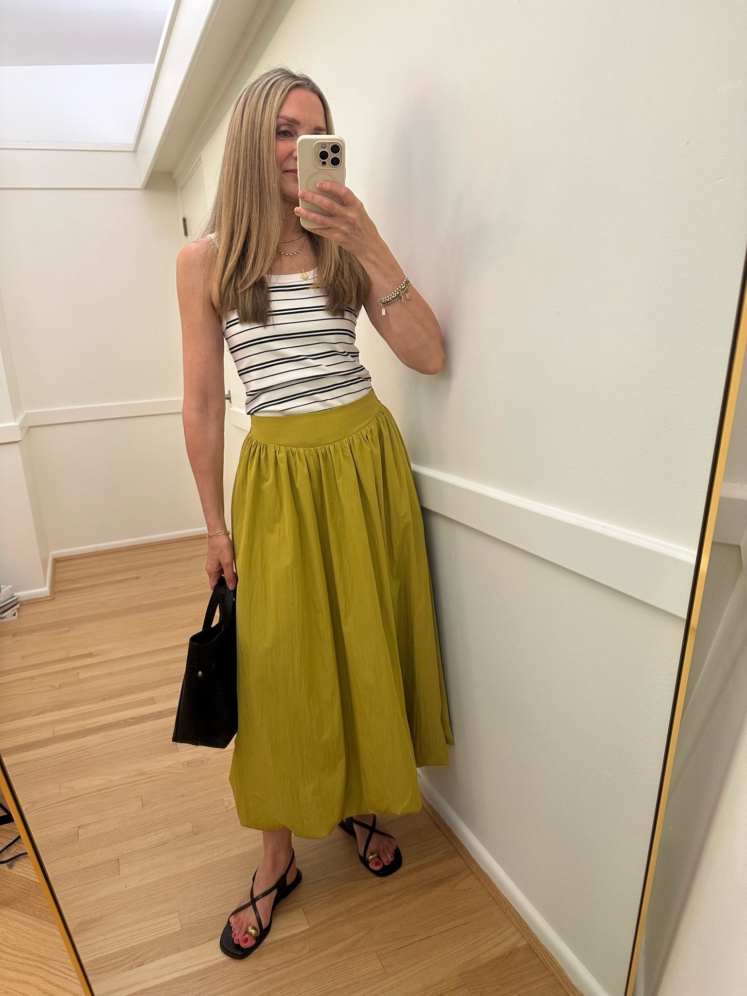 Viral Amazon bubble hem skirt that totally lives up to the hype! Styled with my @Spanx striped tank and black accessories! Love this summer look. 

I’m 5’6” and wear small in top and skirt.

#LTKOver40 #LTKTravel #LTKootd