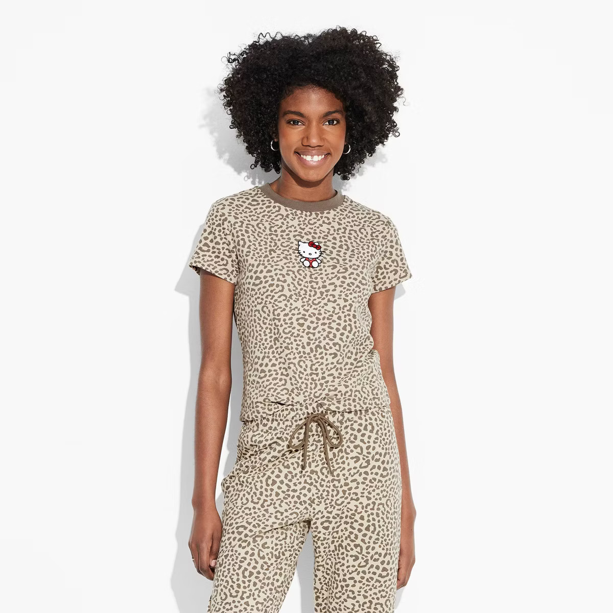 Women's Hello Kitty Leopard Print Short Sleeve Graphic Baby T-Shirt - Beige | Target