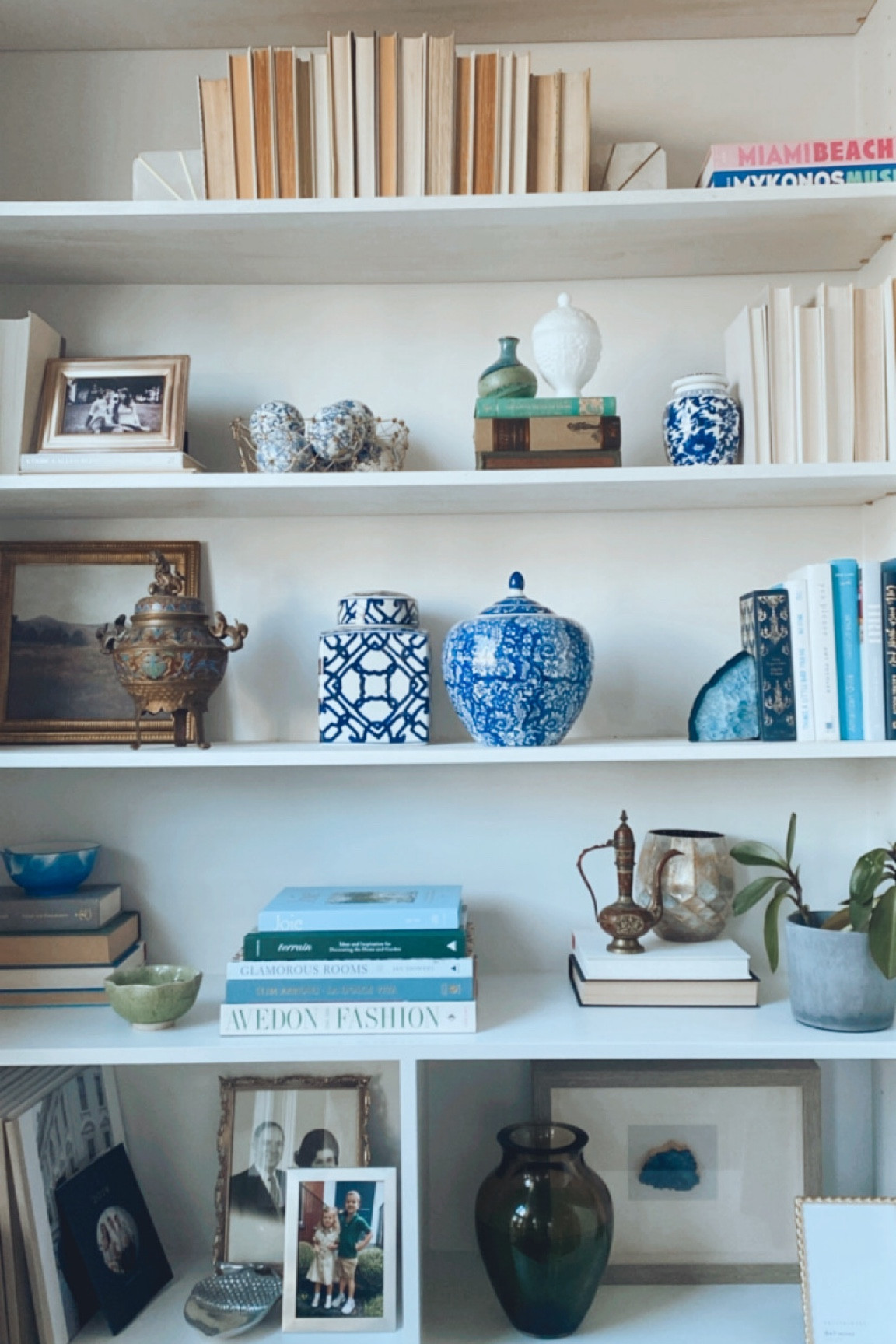 Old money bookshelf, bookshelf wealth aesthetic, Nancy Meyers home decor, lived in home, living room bookshelves, coffee table books, ginger jars, grandmillenial style, 

#LTKhome #LTKfindsunder100 #LTKover40