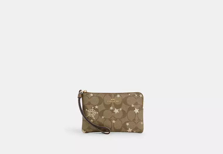Corner Zip Wristlet In Signature Canvas With Star And Snowflake Print | Coach Outlet US