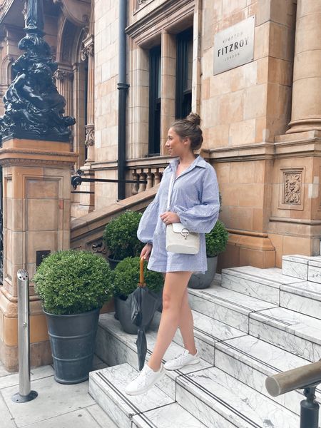 Obsessed with this puff sleeve blue striped long sleeve romper, the perfect easy travel look! Wore this on our rainy London visit! 

Summer outfit. Travel outfit. Vacation styles. Comfortable walking shoes. Affordable crossbody. European handbag. 

#LTKSeasonal #LTKstyletip #LTKunder100