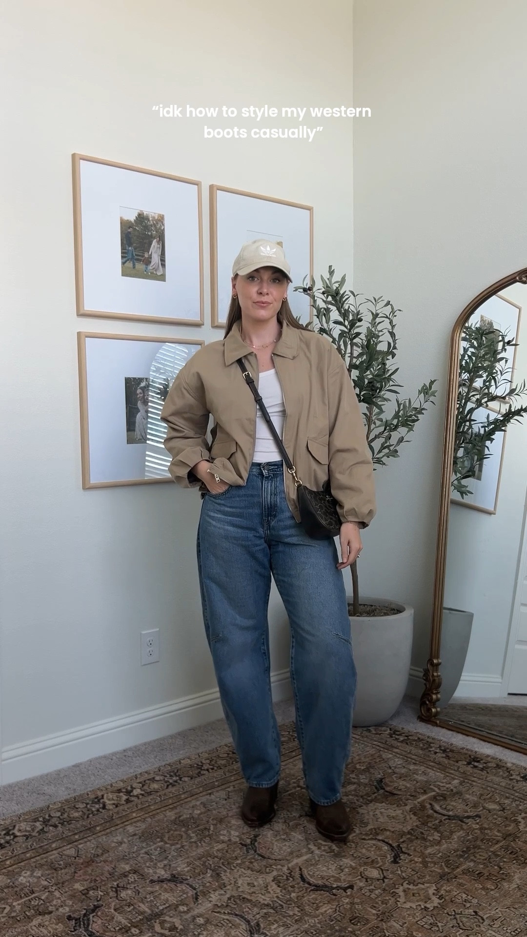 who said boots can only be “western wear” 😏 walked around the HSLR grounds yesterday showing bub all the animals & fun things in this cutie casual spring outfit 🤠🫶🏼 

this cropped trench is currently on sale for under $30 & also comes in denim! ✨

#ootd #tecovas #casualstyle #springfashion #levisjeans 

#LTKmomlife #LTKootd #LTKSeasonal