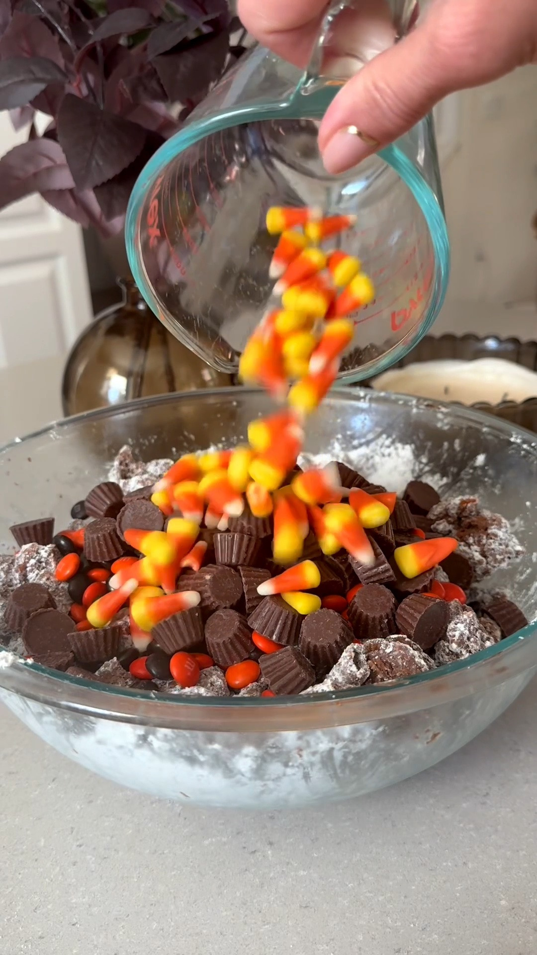One of my favorite sweet treats with a Halloween twist 💀🎃👻 This would be perfect to bring to a Halloween party! Easy to make and so yummy 😋 
Ingredients
• 5 cups Rice Chex Cereal
• 1 ½ cups semisweet or dark chocolate chips
• 1 ½ cups creamy peanut butter
• 1 ½ cups mini pretzels broken into pieces
• 2 cups powdered sugar
• 1 ½ cups of Halloween M & M’s 
• 1 cup peanut butter cups
• 1 bag of candy corn

In a large bowl, combine rice Chex cereal and pretzel pieces.
Melt peanut butter and chocolate together, either on the stovetop or in the microwave.
Pour peanut butter chocolate mixture over cereal/pretzel mixture and stir to combine.
Chill in the refrigerator until the mixture just barely begins to set up (about 30 minutes).
Remove the mixture from the refrigerator.
In a separate, large bowl, put ½ cup powdered sugar on the bottom of the bowl. Add half of the chilled mixture, then add another ½ cup powdered sugar over the cereal and the remaining chocolate/cereal mixture.
Gently stir until the powdered sugar is evenly distributed, tossing to coat the cereal with powdered sugar.
Chill the mixture again in the refrigerator until it’s set (about another 30-60 minutes).
Add more powdered sugar, ¼ cup at a time until the cereal/pretzel mixture is coated.
Add M&Ms, candy corn and peanut butter cups and stir to combine.
Transfer to a serving bowl and serve.

Amazon, Target, puppy chow, Halloween puppy chow, Halloween snacks, Halloween party, Halloween hosting, reindeer food, seasonal treat, kids snack, Halloween dessert