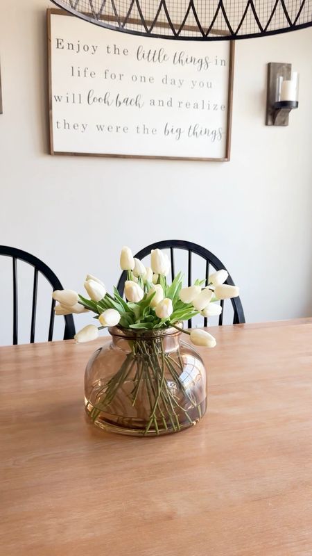 Easy hack to make faux florals look even more realistic! Add water! These beautiful tulips already look pretty real in this gorgeous amber glass vase but with the water you’d never know they were fake! #fauxgreenery #tablecenterpiece #kitchentable #springhomedecor

#LTKxTarget #LTKhome #LTKstyletip