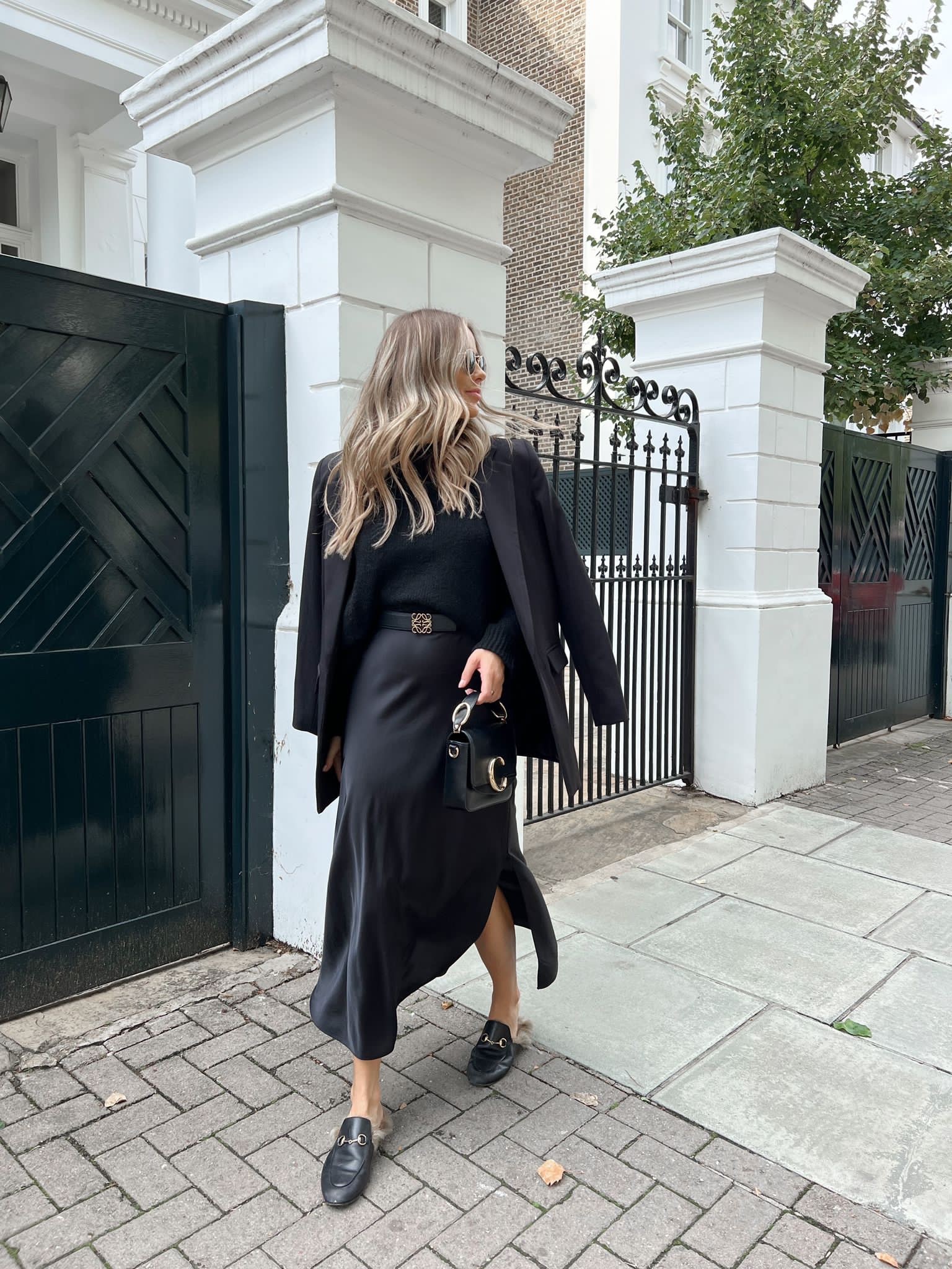 All black classic autumn look. Satin slip dress, knit jumper, black Loewe belt, rayban sunnies, Gucci fur princetown loafers, Chloe mini c bag  

#LTKSeasonal #LTKstyletip #LTKshoecrush