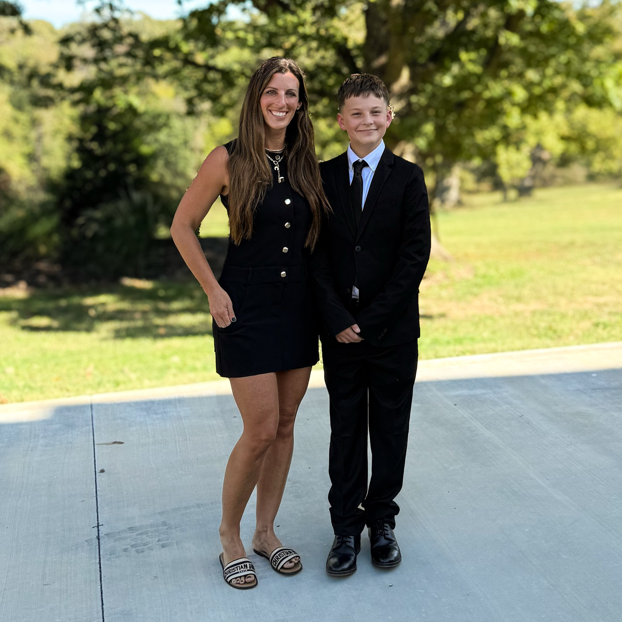 So proud of this boy for completing his first round of cotillion tonight.  From dancing to a four-course etiquette dinner, it was such a great experience. Our boy is growing up too fast! 

Outfit details:
I’m wearing a classic sleeveless black mini dress with gold button accents, paired with Dior slides for a chic yet comfortable look. Layered gold necklaces add a little polish without overdoing it. Little man looked so handsome in a black suit, crisp white dress shirt, and a slim black tie — perfectly dressed for his big evening!

Searchable keywords:
#cotillion #boymom #momandson #formalstyle #etiquetteclass #familymoments #blackdressstyle #diorslides #minidressoutfit #classicstyle #kidsfashion #momswithstyle #liketkit #LTKfamily #LTKstyle #LTKfashion #momstyle #momlife #LTKkids #cotillionnight #proudmom #dressylook #momandsonstyle

#LTKFamily #LTKKids #LTKParties