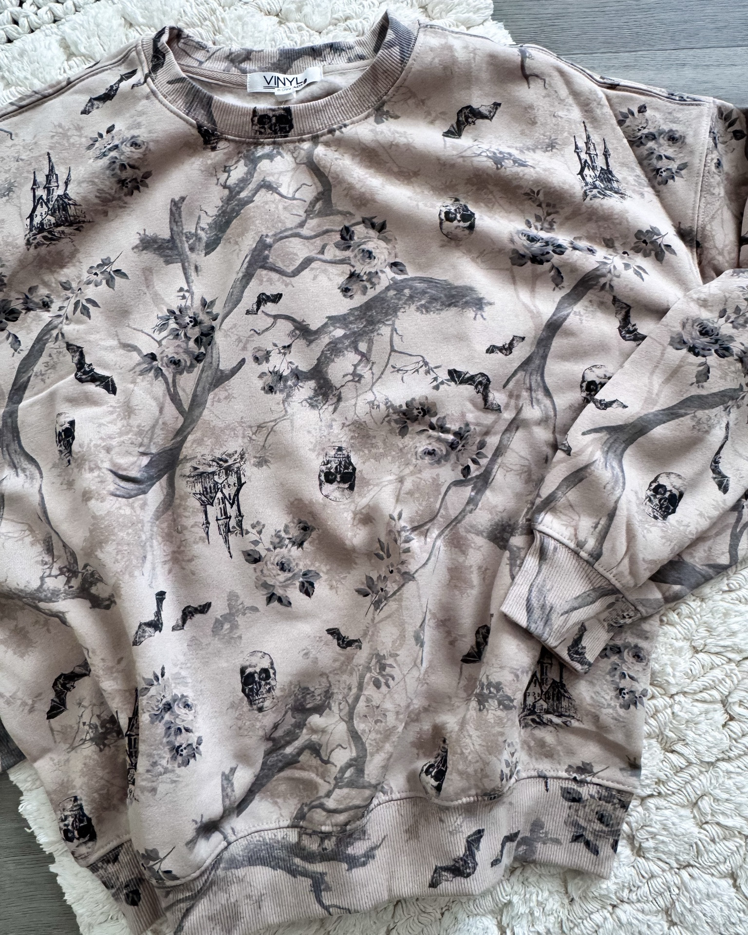 The CUTEST Halloween Sweatshirt! 

If spooky season had a soft, romantic, vintage-inspired side… THIS would be it! I’m obsessed with the gorgeous muted taupe/gray background covered in bats, skulls, haunted houses, moody florals, and spooky trees. It gives haunted cottage meets vintage Halloween and I love that it’s spooky without being overly bright or cheesy.

The neutral color palette makes it SO easy to style with black jeans, leggings, denim, boots, or even a cute skirt for a more dressed-up Halloween look. And the relaxed sweatshirt feel makes this one perfect for pumpkin patches, Halloween movie nights, fall errands, or cozy weekends at home.

Basically… spooky, but make it chic. 

#HalloweenStyle #HalloweenOutfit #HalloweenSweatshirt #SpookySeason #SpookyStyle #FallFashion #FallOutfit #HalloweenFashion #SpookyChic #HalloweenVibes #VintageHalloween #GothicStyle #MoodyStyle #WitchyStyle #CozyFallStyle #PumpkinPatchOutfit #HalloweenDecor #FallFashionFinds #LTKFinds #LTKStyle #LTKCreator #ShopMyStyle #TrendingFashion #FallFinds #SpookyCute #HalloweenCute #NeutralStyle

Halloween sweatshirt • Halloween pullover • spooky sweatshirt • cute Halloween sweatshirt • vintage Halloween sweatshirt • neutral Halloween sweatshirt • Halloween outfit • spooky season outfit • Halloween fashion • fall sweatshirt • fall outfit women • spooky chic outfit • gothic Halloween sweatshirt • vintage spooky sweatshirt • bat sweatshirt • skull sweatshirt • haunted house sweatshirt • Halloween graphic sweatshirt • cozy Halloween outfit • pumpkin patch outfit • Halloween party outfit • neutral fall fashion • trendy Halloween clothes • cute fall sweatshirt • women’s Halloween clothing

#LTKSeasonal #LTKootd #LTKOver40