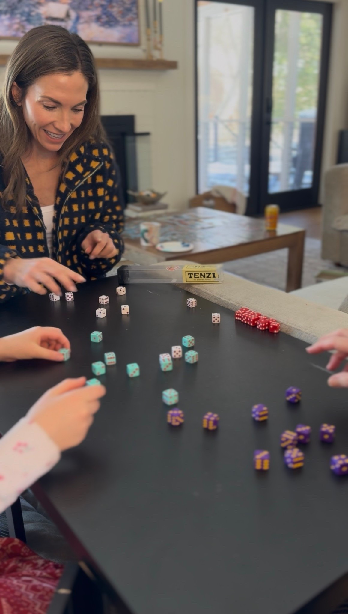 TENZI!!

This is our absolute favorite easy family game. Perfect for the snow days when we are stuck at home. You can play with four players using the original rules where you each try to roll all of your dice to land on the same number. Whoever does it first wins! But because it’s dice, there are endless possibilities to make up rules for new games.