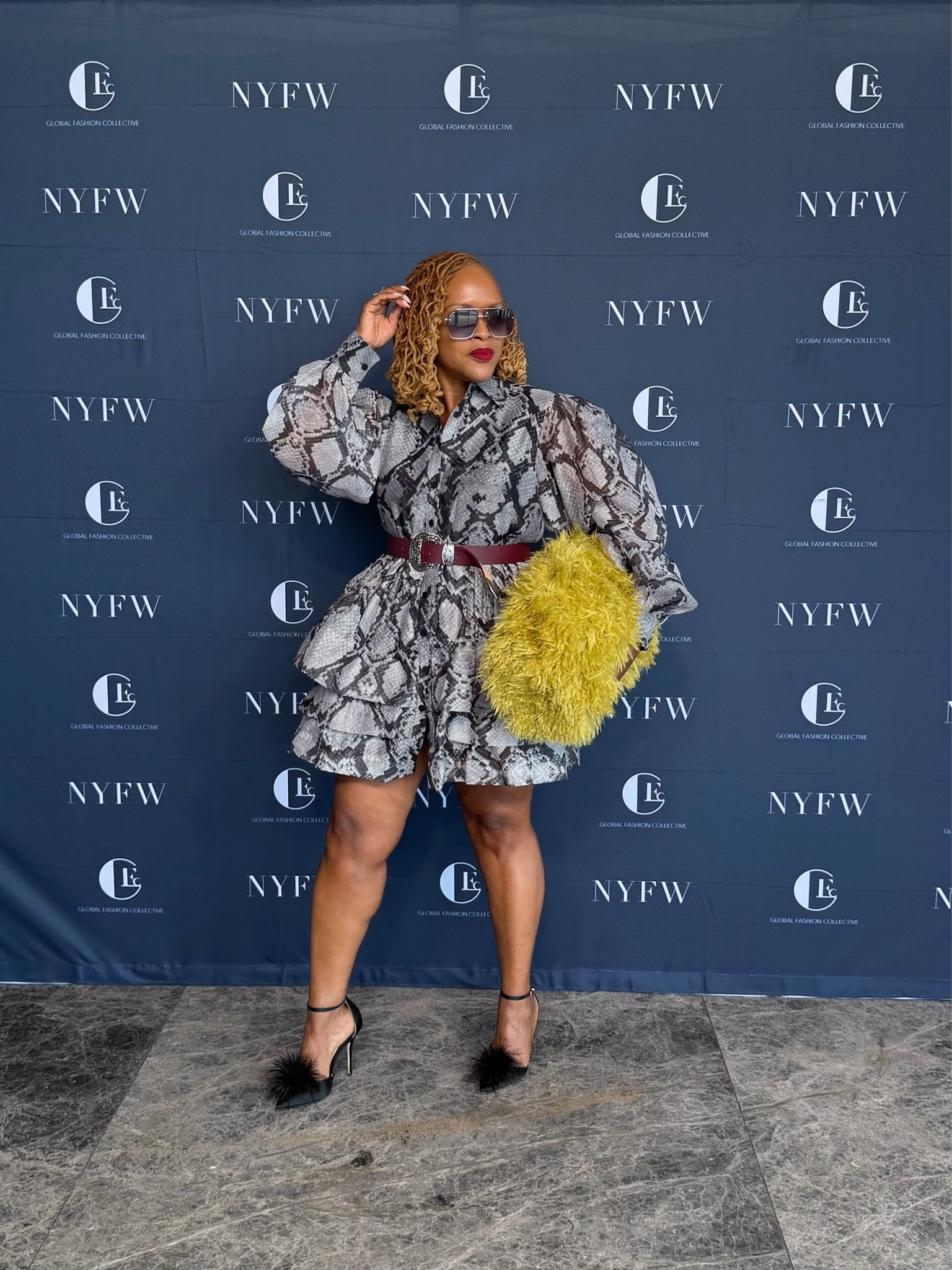 Snake print dress at New York Fashion Week can be worn in the fall  with boots

#LTKootd #LTKdayinmylife #LTKOver40