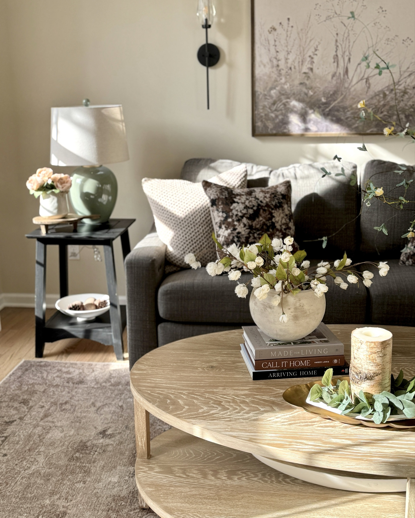 Onyx shelf 
Solid wood end tables
Electric wall sconce
Solid wood custom wall art
Area rug
Throw pillows
Curved arm floor lamp
Stacking tables
Spring florals
Easter decor 