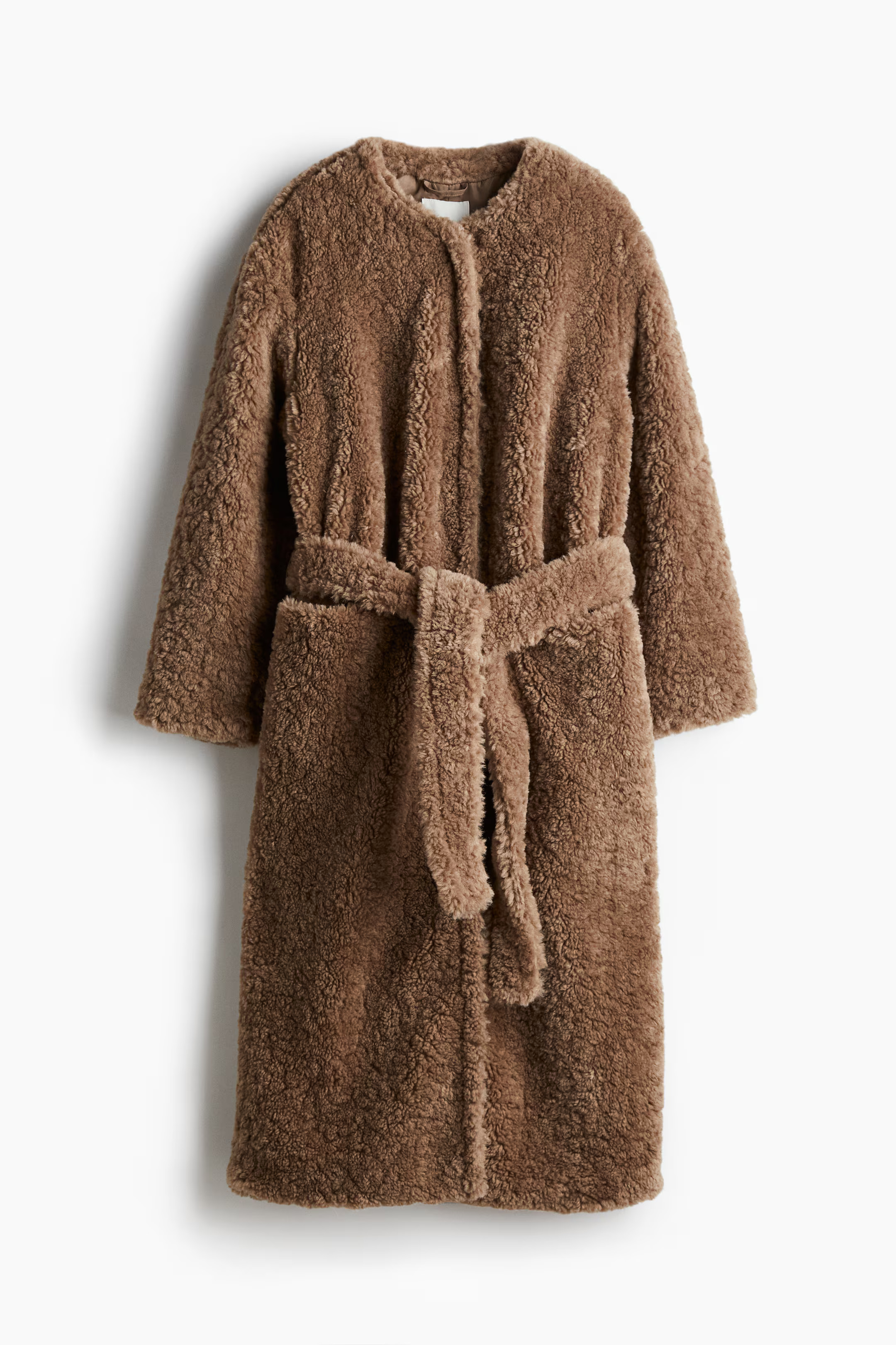 Fluffy jas met strikceintuur | H&M (DE, AT, CH, NL, FI)