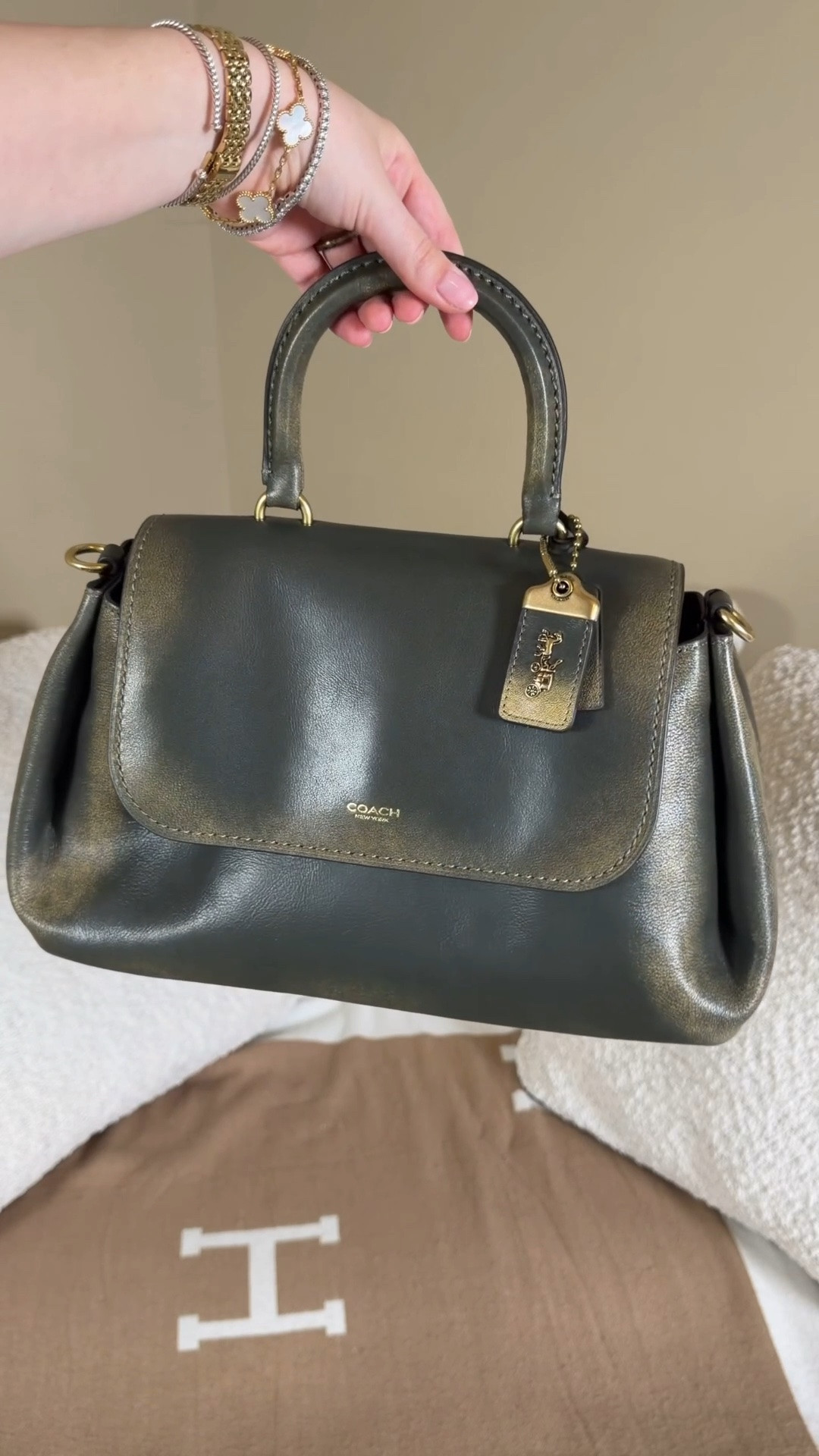 My dream bag 😍🫒 she wa sour of stock but is we he randomly pop up available so comment SHOP & I’ll dm you the links so you can check for restocks ♥️

I found the Coach green loved leather slouchy Rogue and knew she had to come home with me 😍

The loved leather line has really grown on me and I had no idea it came in green which is my favorite color and as a Rogue which is one of my favorite bags!