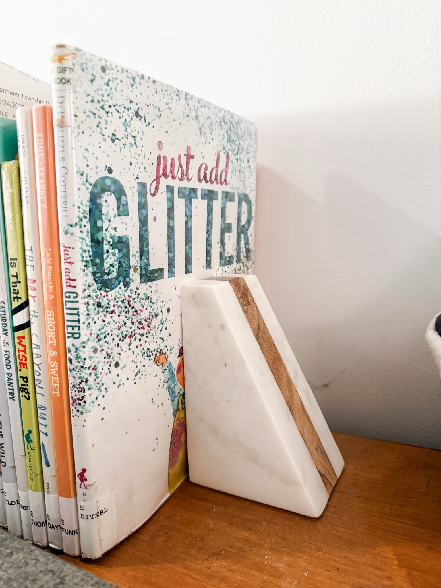 I got this beautiful wood & marble set of bookends for our table behind our couch so that I can set out our library books and keep them within easy reach for everyone in the family. I also plan to set out our seasonal books for the kids.

#LTKmomlife #LTKHome #LTKKids