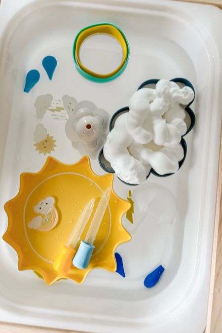 A weather themed water sensory bin for our #LTKtoddler ☀️💦❄️🌬️☔️ I was inspired by @teachingbythemountains and used a good number of the same items she’s shared in our water bin for our Playing Preschool (by @busytoddler) unit on weather. The large sun and cloud are from @nature.based.toys 🌤️

#LTKKids