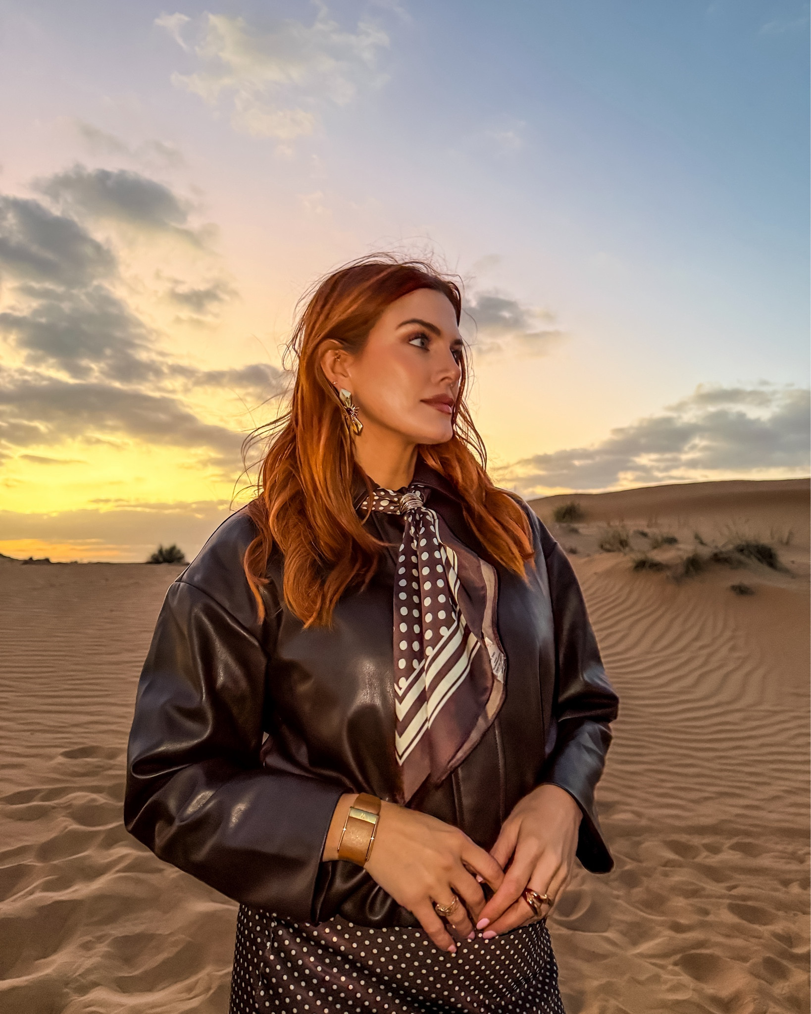 Brown on brown on brown on sand! 🐪

I absolutely adore this combo, the brown leather jacket, the brown polka dot skirt midi skirt with lace and the matching brown polka dot scarf!! 

The brown boots are from carvella ❤️