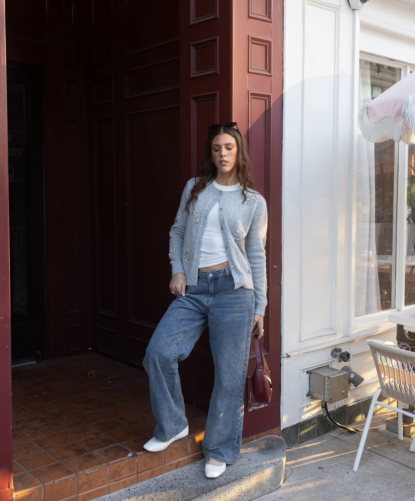 casual & classy 🩶💄 sweater gifted from @karen_millen #MyKM #KarenMillenPartner 
•
•
effortless chic, pinterest aesthetic, style ideas, fashion blogger, city girl, city chic, aesthetic outfits, chic style, nyc style, fall style, fall fashion, sweater weather, chic fall style, fall outfit ideas, pop of red, cardigan style, embellished sweater, casual chic, classy style, low rise jeans, simple style, everyday style