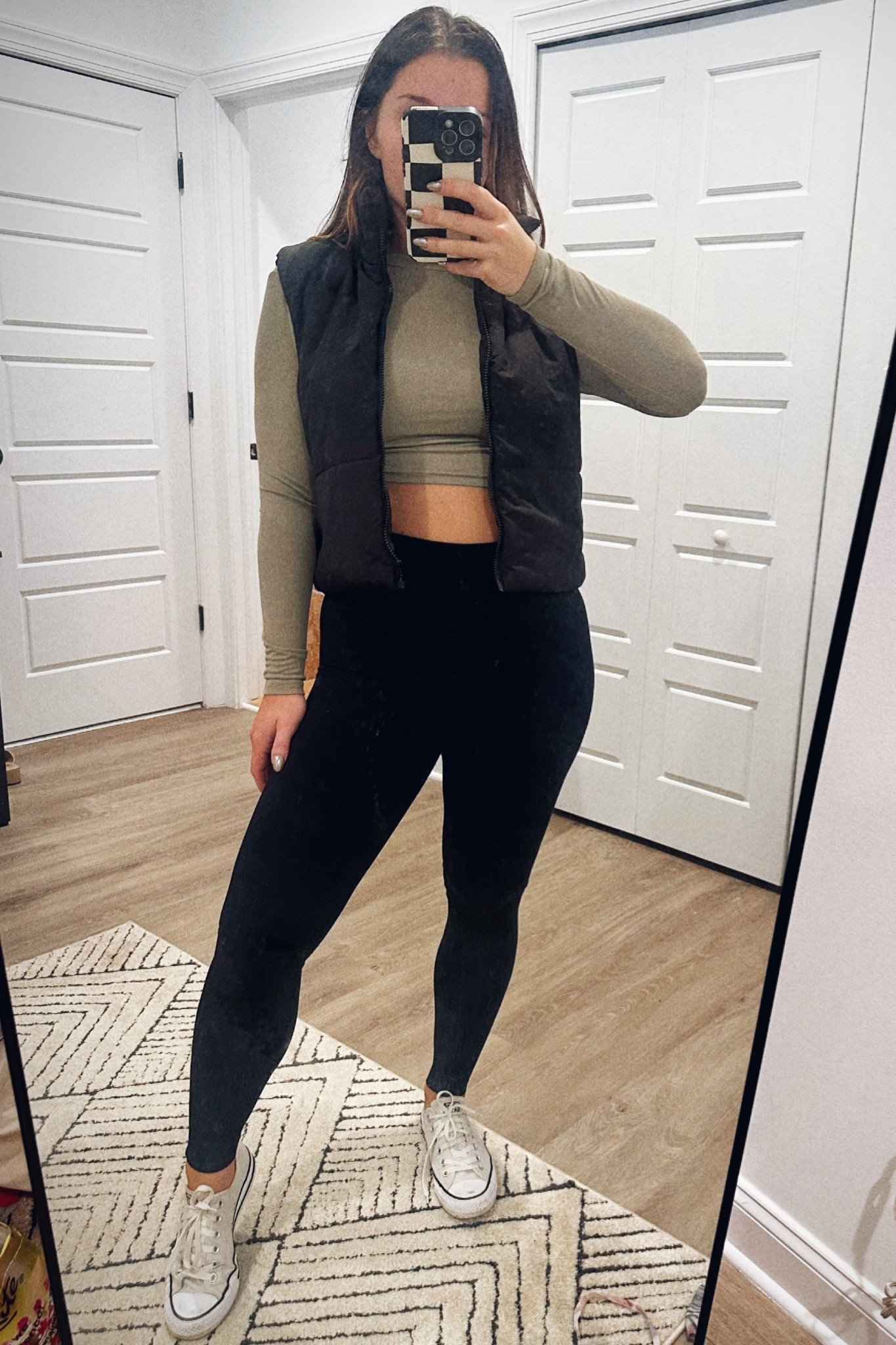 Leggings, green cropped top, vest, and converse sneakers 

#LTKfindsunder50 #LTKstyletip #LTKSeasonal