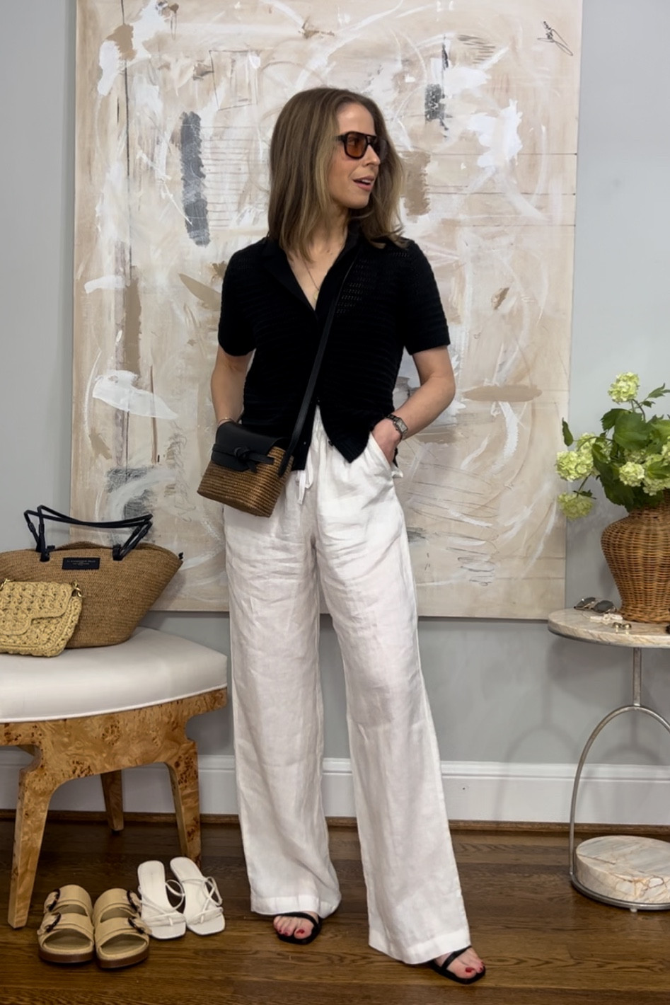 Casual vacation style black and white with linen pants
Splendid white linen pants code KELLY20
Black crochet polo Everlane old
Flattered black sandals
Cesta collective rattan crossbody
Vehla sunglasses retro frame 

#LTKstyletip #LTKtravel