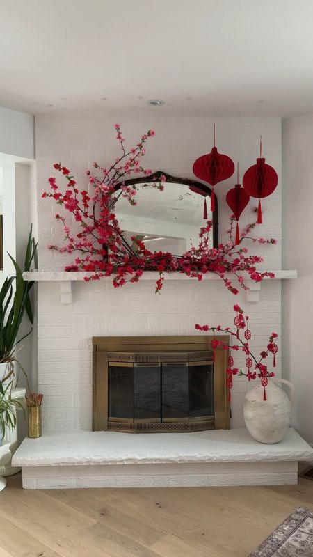Here’s how I created this romantic Chinese and Lunar New Year fireplace mantel decor! 

I shared in the last post how plum blossoms symbolizes resilience in the face of adversity because they bloom in the harsh winter. So when we decorate with these stems we think of hope, hang on a little while longer for spring is coming. I think it’s so poetic and beautiful. 

Linking some plum blossoms here!

#LTKSeasonal #LTKparties #LTKhome
