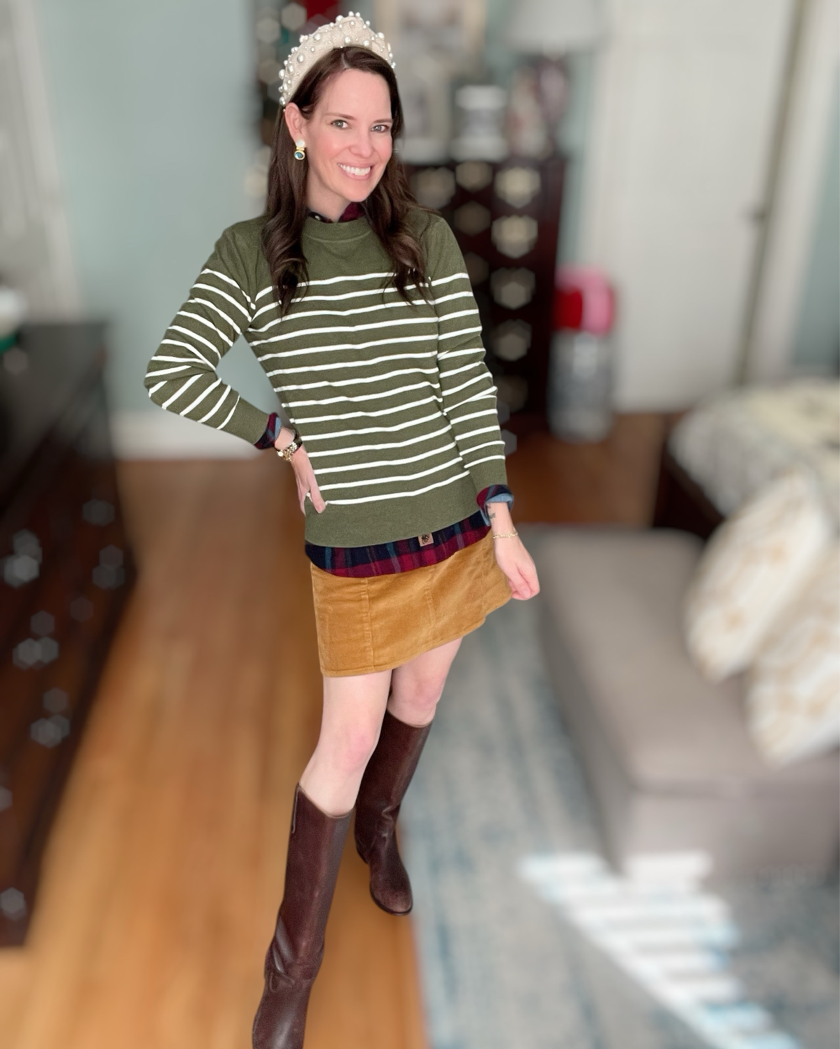 This one feels like classic Christmas in the mountains 🍂🎄 The olive striped sweater layered over the plaid flannel is giving the cutest preppy mix without being too loud — just cozy and intentional. The peek of the collar + hem adds texture and warmth instantly.

Paired it with the mustard corduroy mini to bring in that warm golden fall-to-winter tone — it makes the whole outfit feel softer and more seasonal. And the dark brown riding boots keep it timeless + practical + polished. This is such an easy weekend outfit that still looks like you tried without overthinking anything ✨

You know I had to finish it with the pearl headband 🎀🤍 It just adds that tiny bit of holiday magic — perfect for cookie decorating, Christmas market strolling, school events, brunch, errands, all of the cozy December days. The earrings add a beautiful jewel tone pop that ties everything together.

Feels festive, but still wearable. Cute, but not costume-y. Cozy, polished, & very you 💚

⸻

winter outfit ideas cozy layered outfit preppy casual holiday outfit plaid and striped layering corduroy mini skirt outfit riding boots winter style pearl headband festive everyday look classic winter wardrobe christmas season outfits december looks chic mom outfit merry & bright vibes 🎄✨ thanksgiving outfit ideas 

#LTKFindsUnder50 #LTKHoliday #LTKShoeCrush