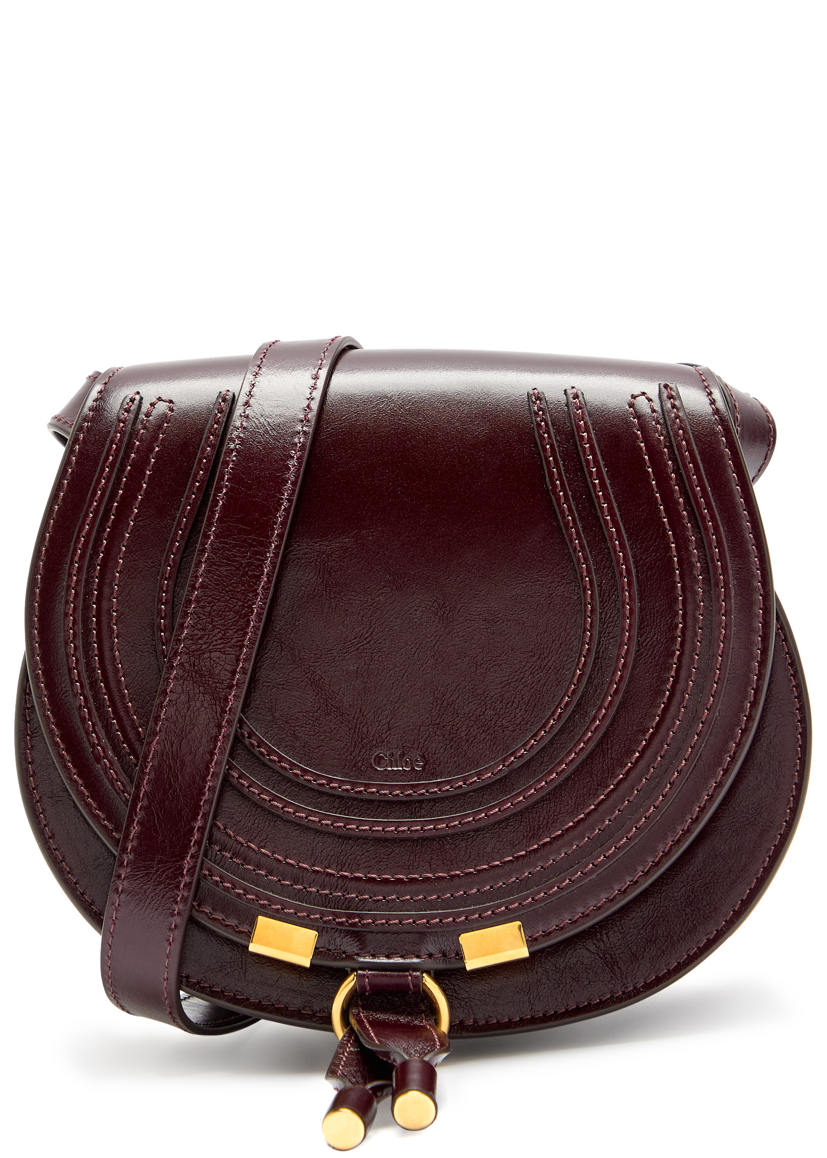 Marcie small glossed leather saddle bag | Harvey Nichols