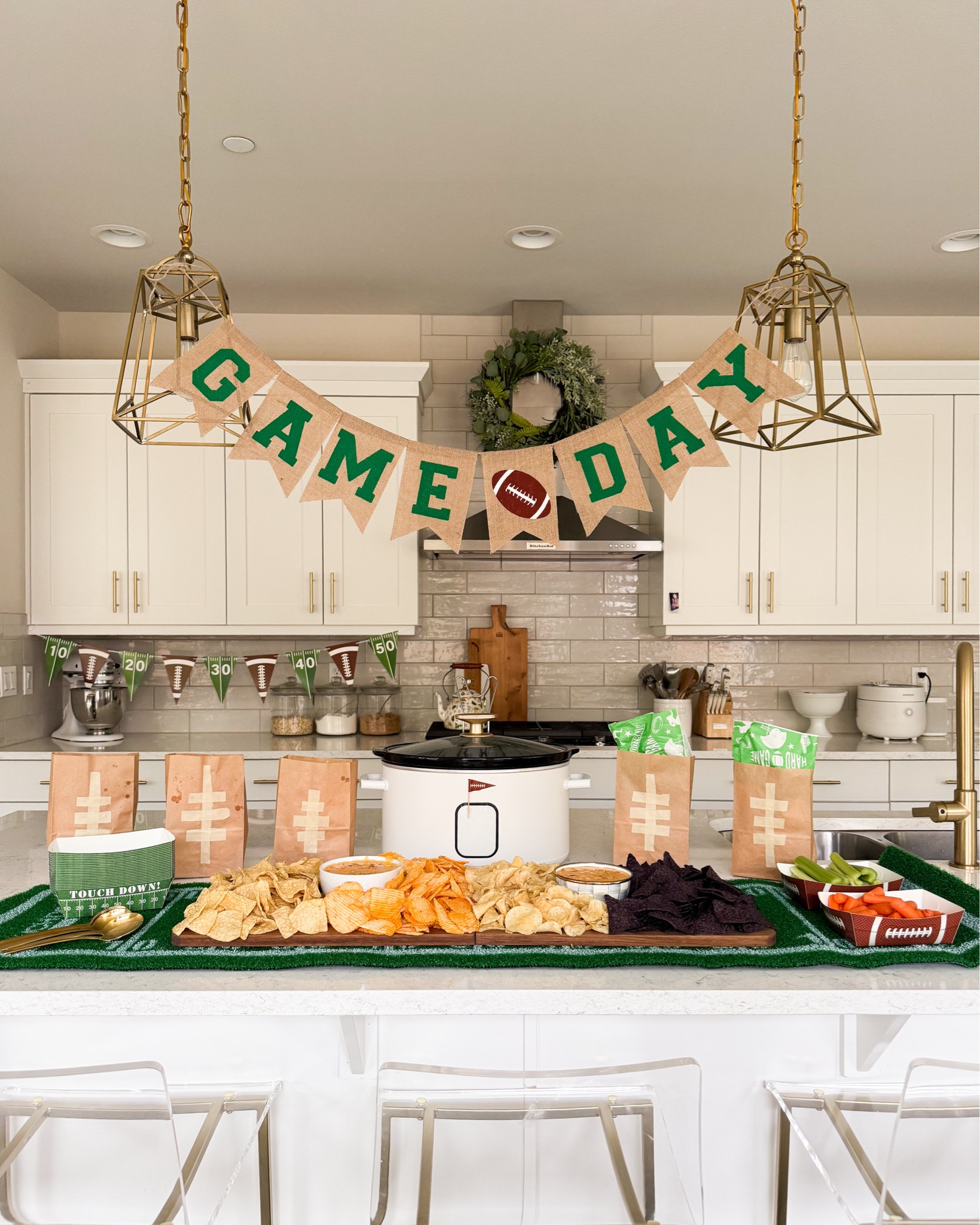 Game day queso chip bar! Game day decor set up in kitchen

Game Day Amazon Finds! Football turf table runner, slow cooker, bar stools, football party supplies, paper lunch bags, foldable charcuterie board, velveeta cheese, game day shirt 

#LTKHome #LTKFindsUnder100