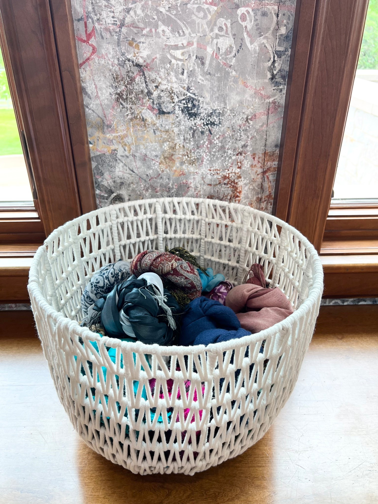 The cutest rope basket from Target used to store rolled up scarves 