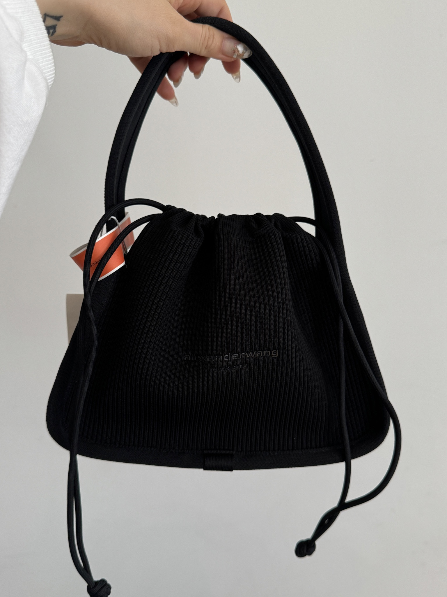 Images of the Alexander Wang small Ryan bag! 

Ultimately, I think I’m keeping the first slide - the black ribbed knit version. Love the woven, but I don’t feel I will get as much mileage from it personally! Quality is gorgeous and these bags are nice and roomy. 

They are both square bags that cinch to close!

Easy to style and love that the knit will work with more casual styles as well. Which would you keep??

#LTKitbag