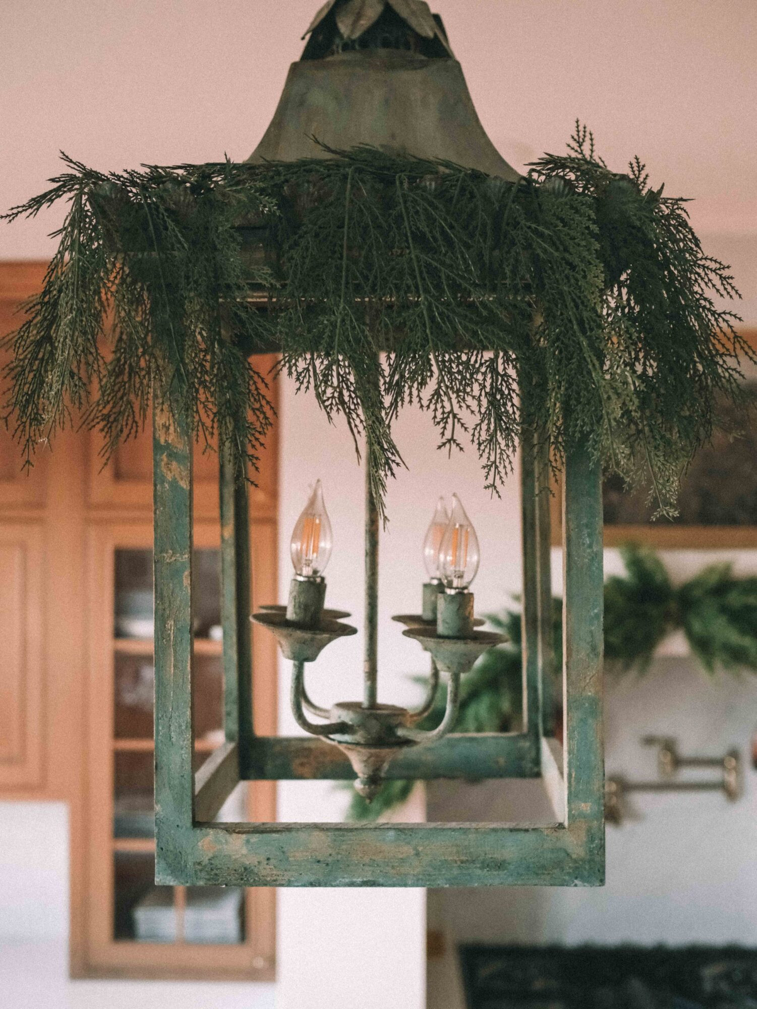 If you have lanterns in your home, bend greenery twigs around them for a festive look and easy holiday decor. This adds warmth to wooden and metal fixtures for a cozier look at the holidays. You can also choose sprigs with berries if you want to add an extra pop of color. 

 #LTKHoliday #LTKSeasonal #LTKHome