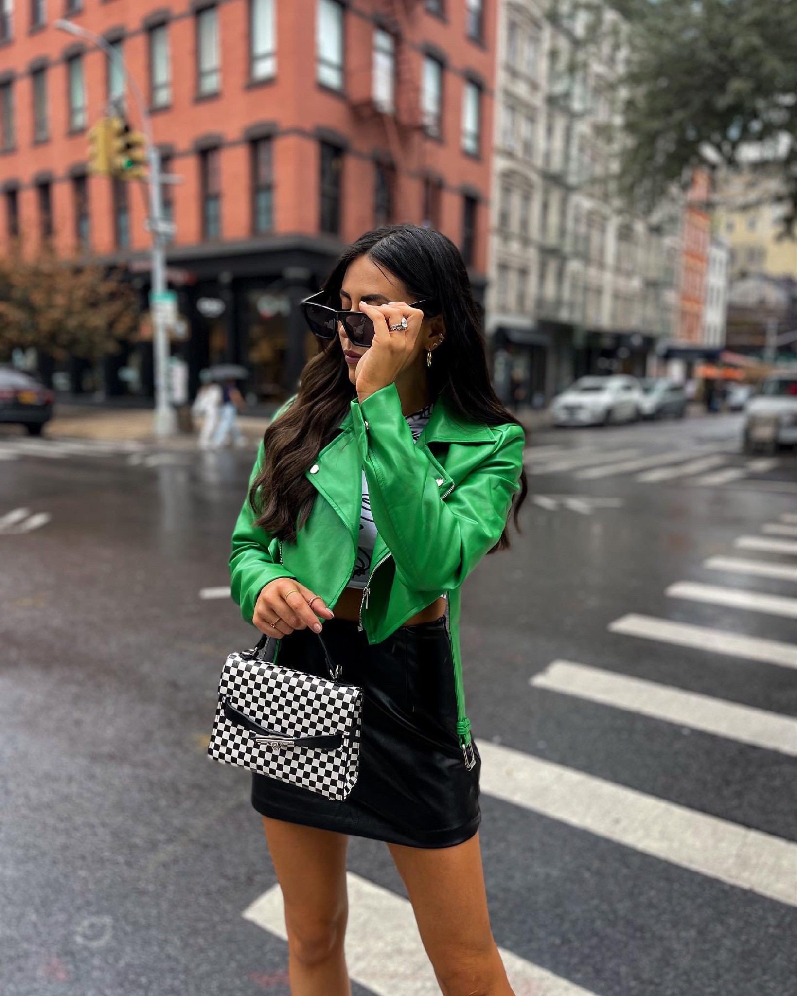 Edgy street style — green leather jacket (size 6), graphic crop top (size small), checkered handbag, green platform heels. Statement shoes + handbag 

#LTKshoecrush #LTKstyletip #LTKunder100
