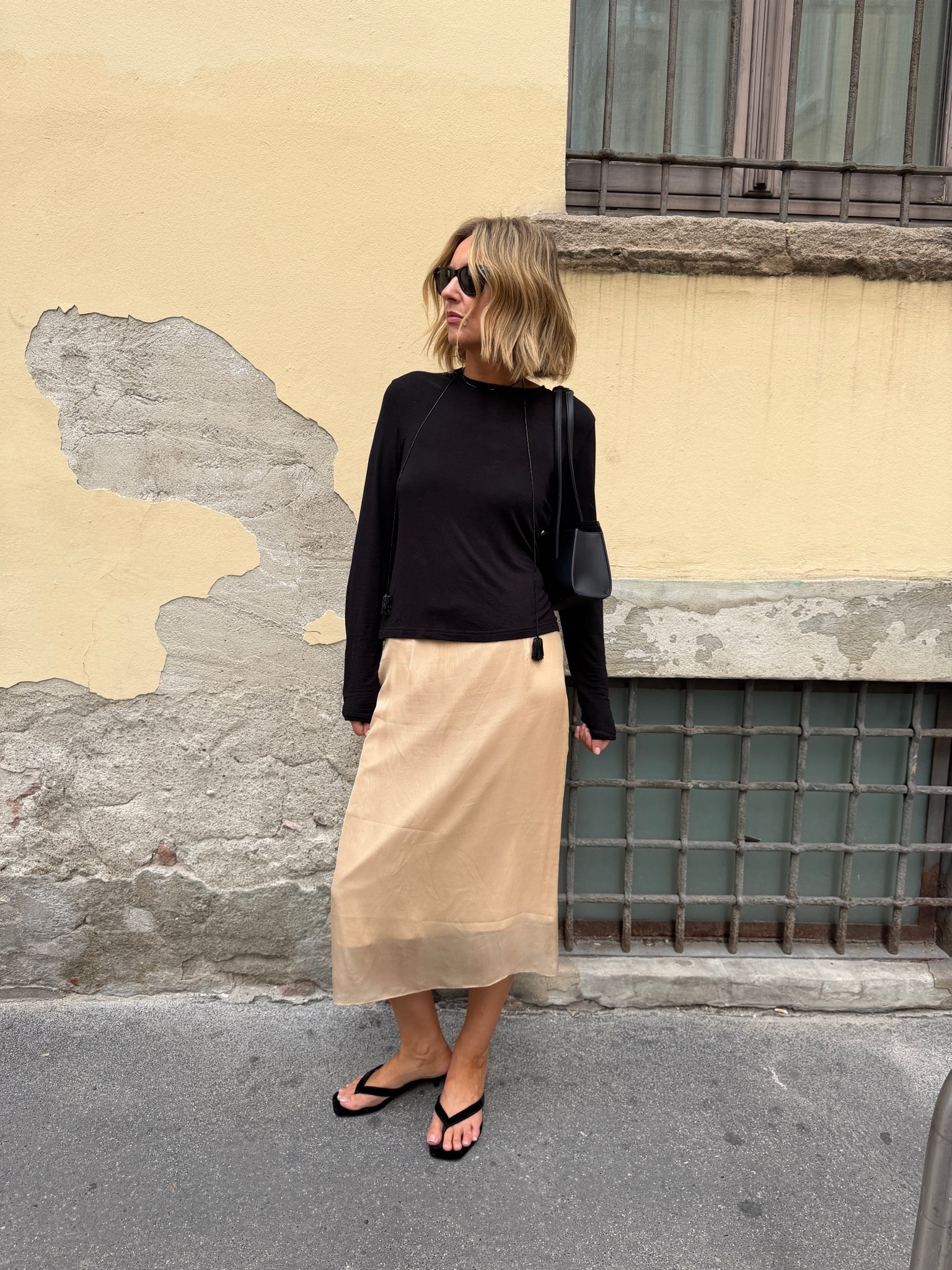 Milan OOTD 🖤

black long sleeve top, exposed seam detailing, camel satin midi skirt, bias cut skirt, black flip flop sandals, black crossbody bag, black square sunglasses, street style, European street style, autumn transitional dressing, casual chic outfit, monochrome styling, neutral color palette, elevated basics, quiet luxury, ltkstyletip, ltkseasonal, ltkfindsunder100, ltkitbag

#LTKeurope #LTKFashionMonth #LTKluxury