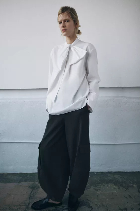 Shirt with lapel collar and long sleeves. Front tie detail with pearls. Front hidden button closu... | Zara US