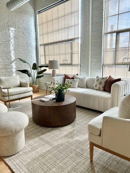 Plaid rug, round coffee table. Tufted cream couch.

#livingroomstyle #tuftedcouch

#LTKhome