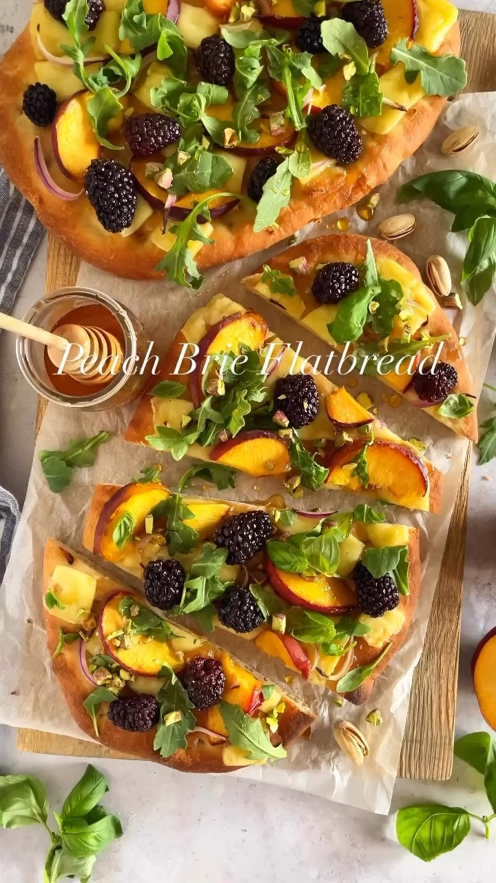 PEACH BRIE FLATBREAD

This flatbread combines the creamy richness of brie with the sweet juiciness of peaches, balanced with red onion, tart blackberries, arugula, and a drizzle of honey. It’s perfect as an appetizer or a light meal!🍑 Full recipe on my blog: https://www.twopeasandtheirpod.com/peach-brie-flatbread/ 

 #LTKHome #LTKFindsUnder50 #LTKFindsUnder100