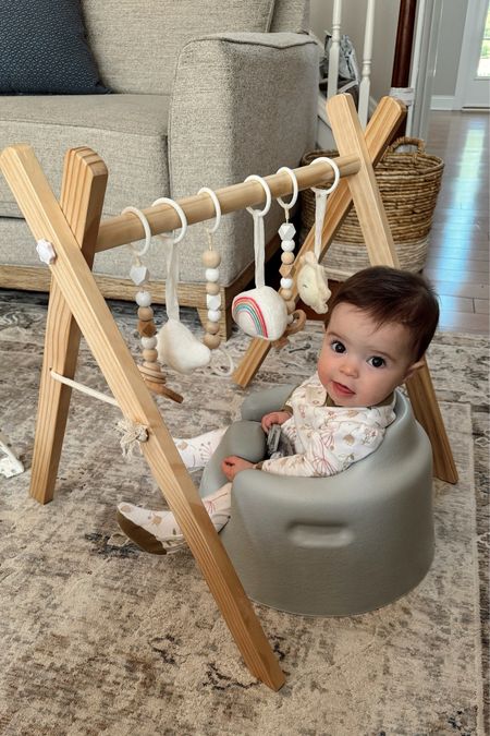 Wes loves playing with her Amazon wooden play gym while sitting in her Bumbo like a big girl! I can’t even believe my little chicky is already 6 months! 🥹 Anyways, if you’re looking for great baby shower gifts (especially gender neutral baby gifts), check these out! We’ve used them a ton (for play and for keeping the kids busy while I do chores and such) and they’re both under $50!

#LTKBaby #LTKBump #LTKFindsUnder50