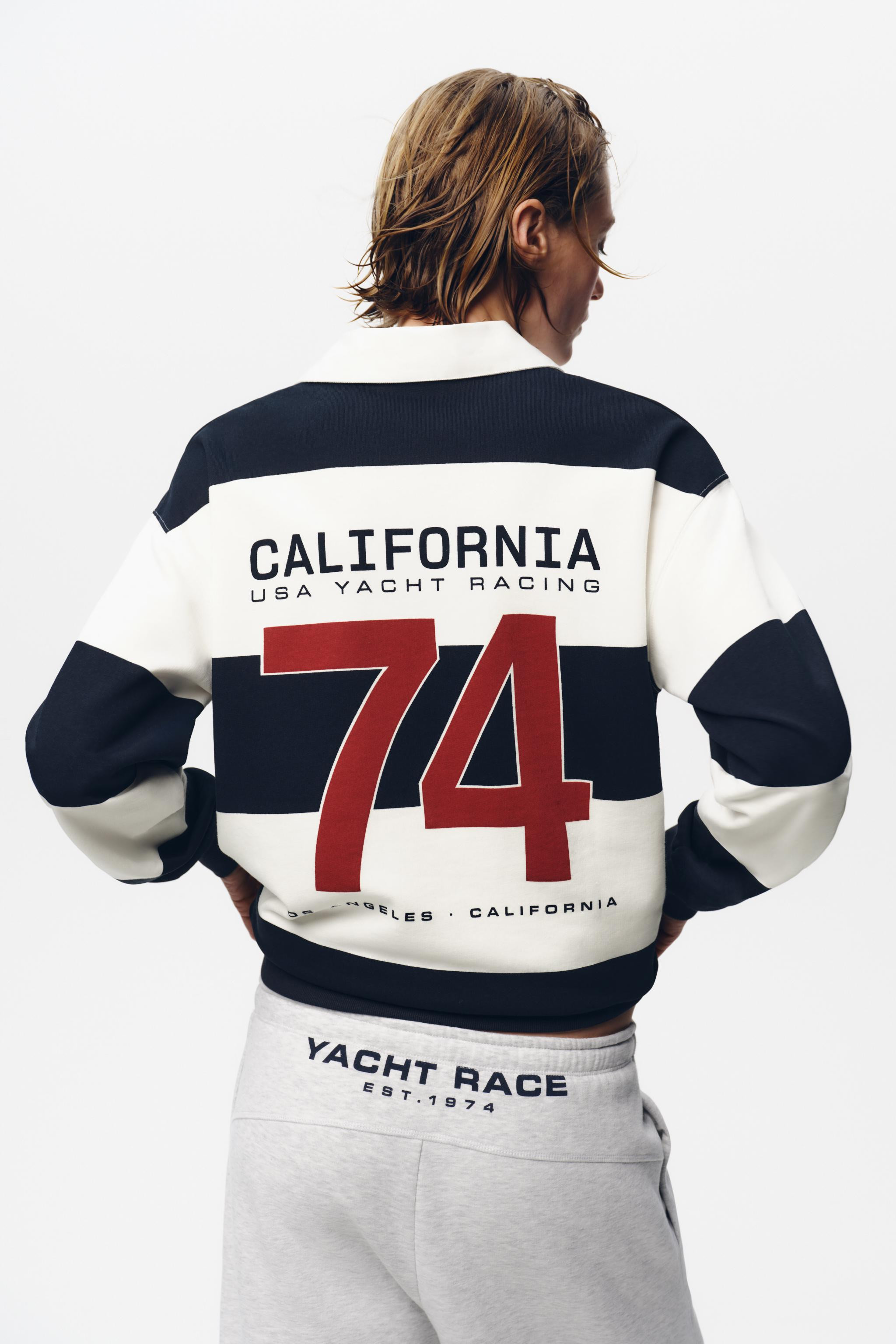 Cotton knit polo shirt. Featuring a collar, long sleeves with cuffs, slogan detail on the chest a... | Zara UK