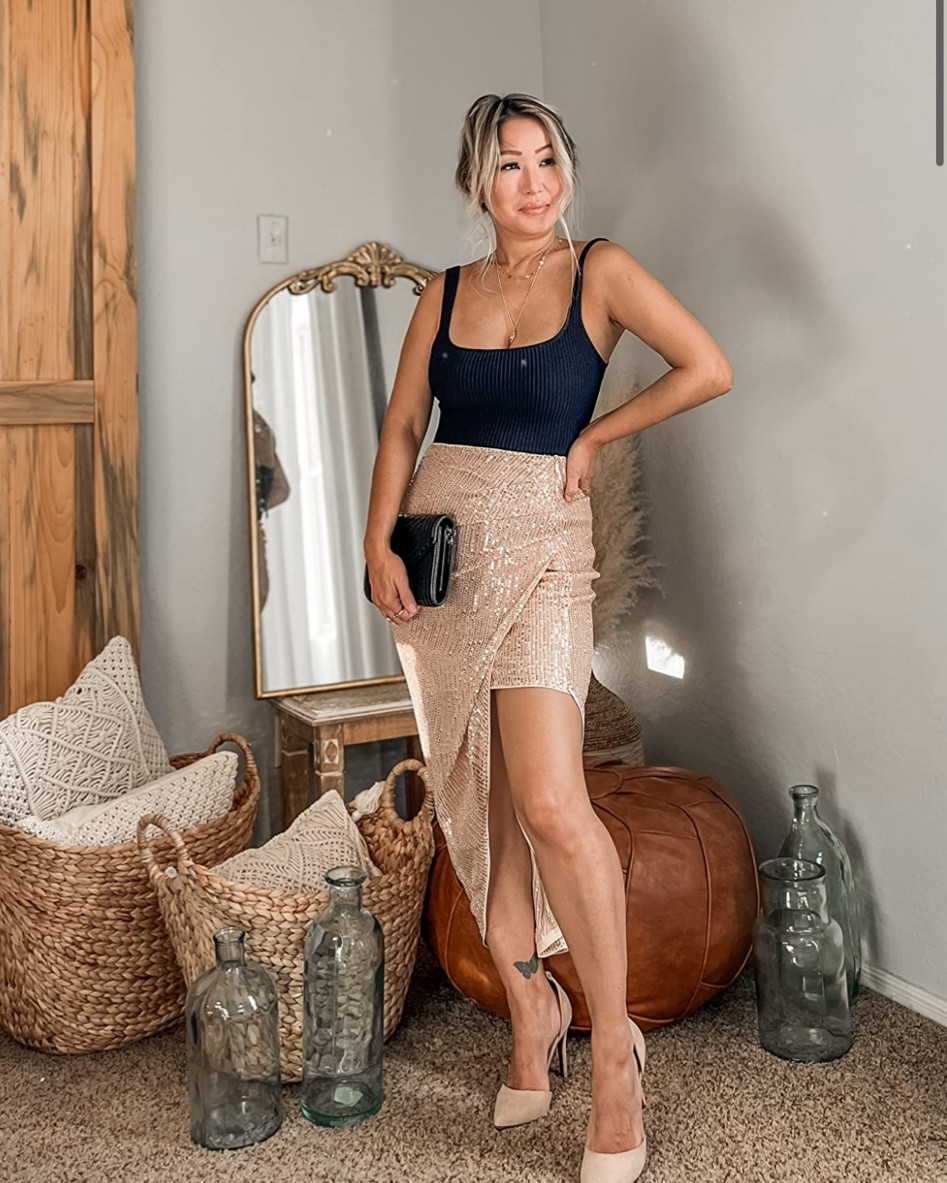 Super cute and chic date night look! This asymmetrical sequin shirt is super flattering and fits great on petite women! 

Date night, night out, cute skirt, black tops, petite fashion 

#LTKsalealert #LTKstyletip #LTKbeauty