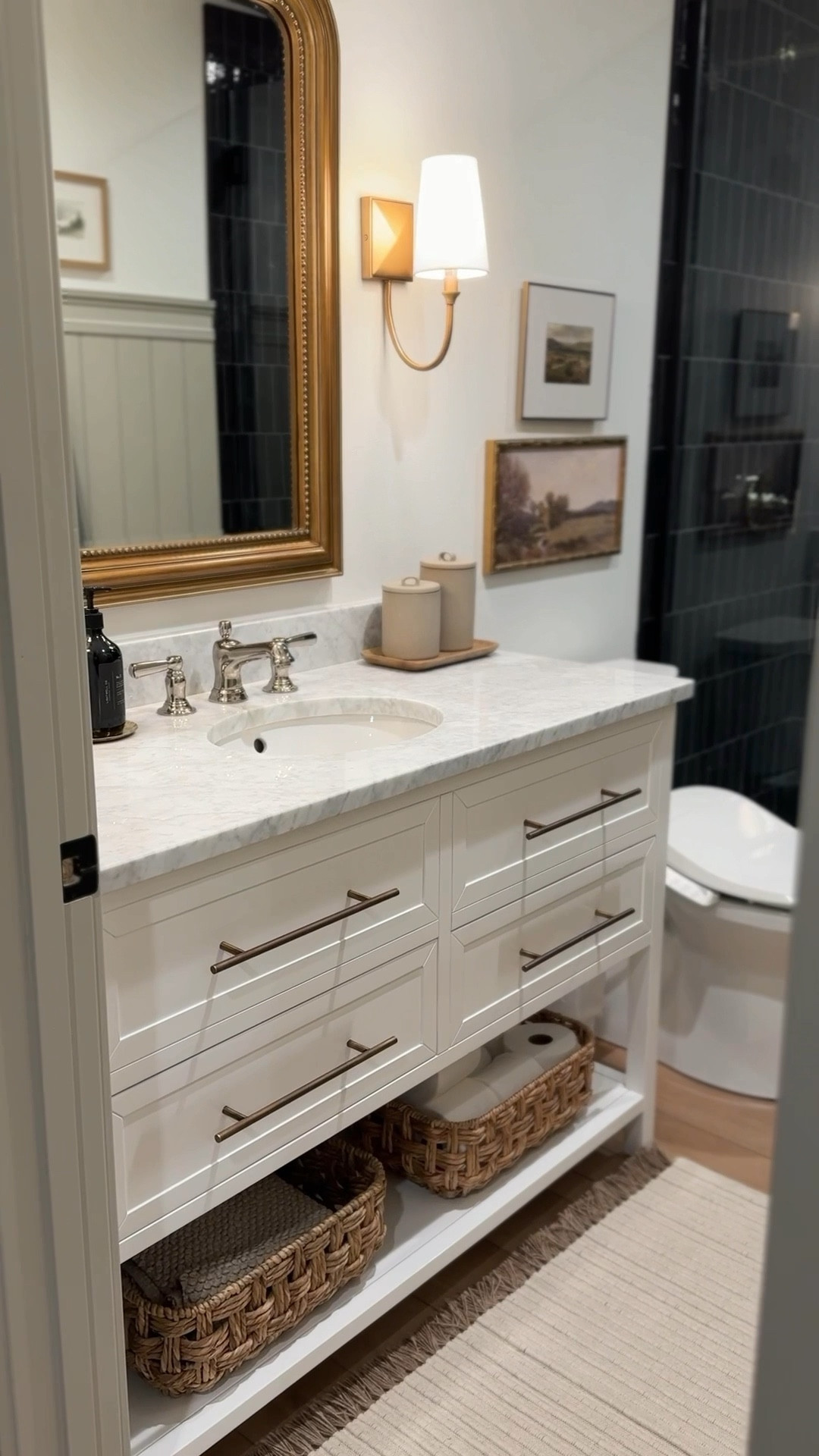 Our basement bathroom deserves another moment because she’s 💅😍

I can’t get over the black tiled shower. So many of you said the black tile would leave water spots m, but because it’s a glossy finish, we haven’t noticed any water spots. 🙌

The marble top vanity and accent wall are also 👌🤌

Binge more of my content + follow @frengpartyof6 for more affordable home finds! 

#bathroom #bathroominspo #bathroomdecor #modernorganic #cottagestyle #amazonhome #amazonmusthaves #bathroomremodel #beforeandafterhome #beforeandafterinteriors 


#LTKFindsUnder50 #LTKSaleAlert #LTKHome