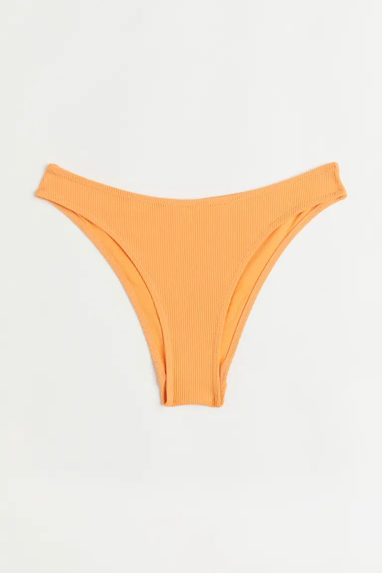 Conscious choice  Fully lined bikini bottoms with a textured finish. Regular waist and cutaway co... | H&M (US)