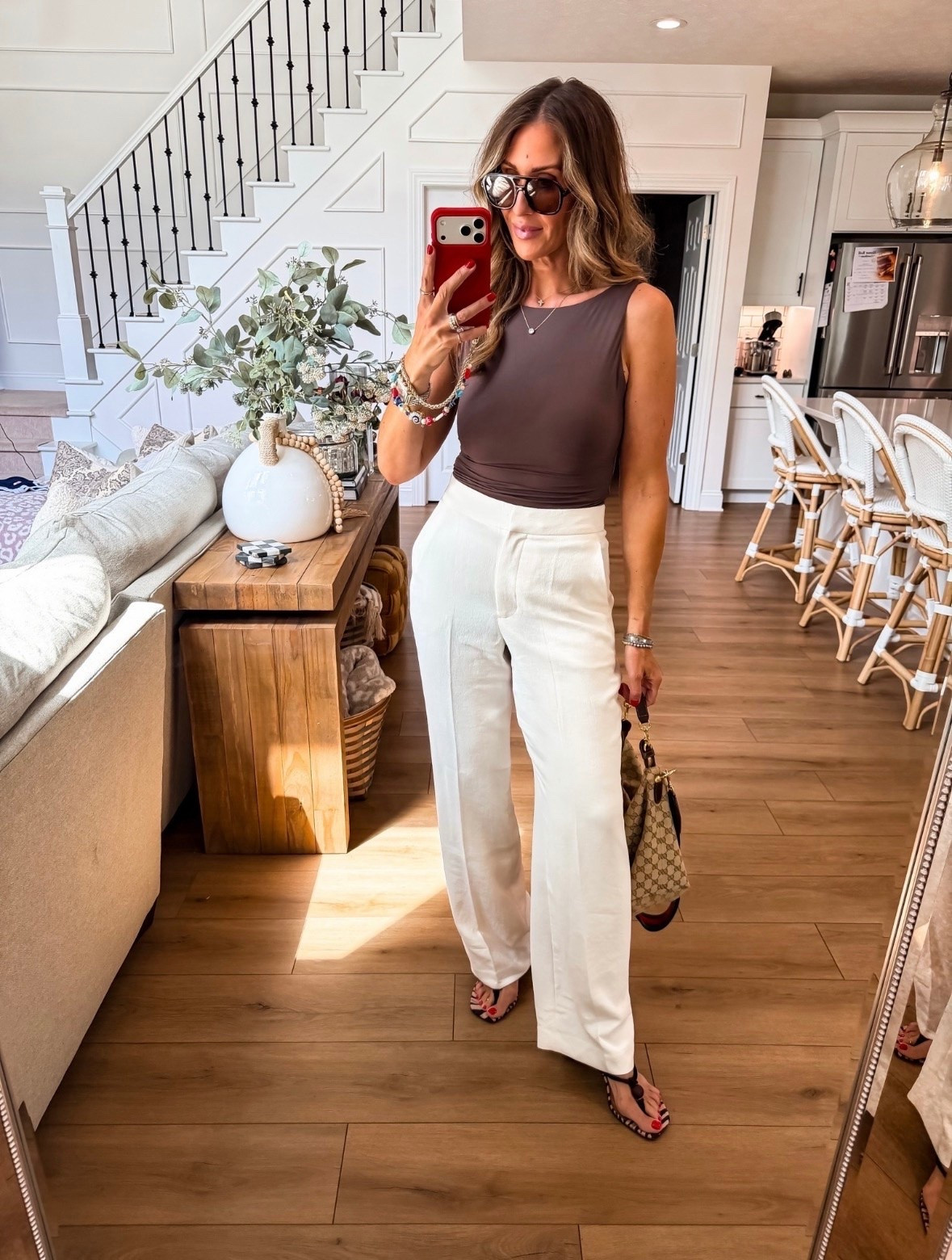 This brown top and white trouser combo is the definition of effortless chic. The neutral color palette feels elevated and timeless, making it perfect for dinner dates, work events, or anytime you want to look polished with minimal effort.

white trousers, brown top, neutral outfit, chic style, elevated basics, summer outfit, workwear inspiration, classy fashion, wide leg pants, capsule wardrobe, timeless style, themominstyle

#LTKootd #LTKSeasonal #LTKOver40