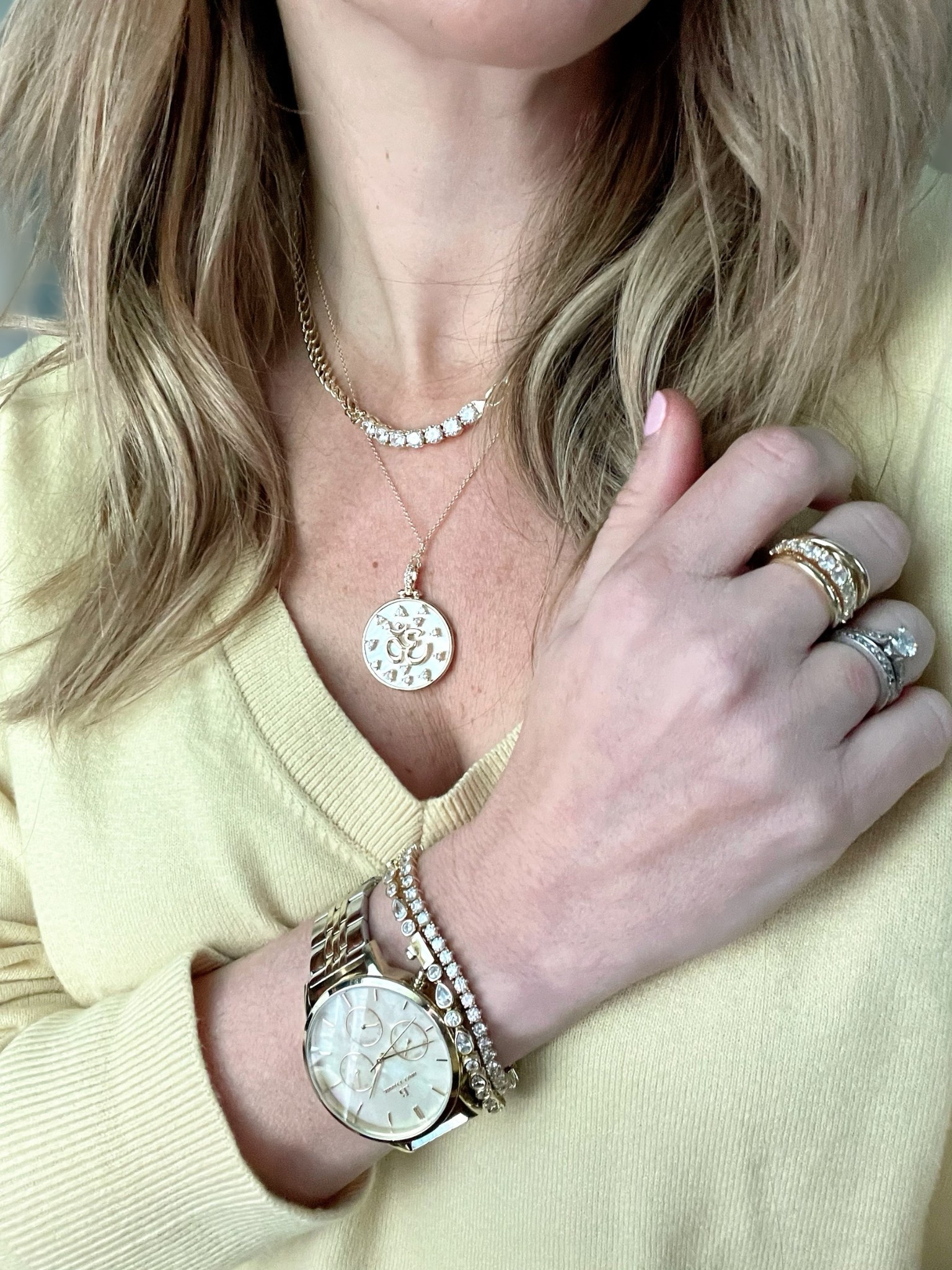 ASHLEYBA for 10% off all Melinda Maria jewelry + free gift with purchase through 4/15! ✨💎💛

Luxe layers I never take off! This stack includes my go-to Melinda Maria tennis bracelets, gold rings, and two dainty necklaces — all perfectly styled with a gold mother-of-pearl watch that’s engraved and timeless ⏱️✨

This look features:
	•	Melinda Maria pave tennis bracelet (I stack two!) 💫💍
	•	Melinda Maria coin pendant necklace — delicate, detailed, and meaningful 🌙🪙
	•	Chunky gold & pave ring stack — mix of textures for everyday sparkle 💛
	•	Gold chain and crystal choker necklace that adds instant glam to any neckline 👑✨
	•	Abbott Lyon engraved watch — a keepsake piece that’s both beautiful and practical ⌚️❤️

Styled with a soft butter yellow sweater, this look blends cozy neutrals with classic glam. Whether you’re dressing up a basic outfit or adding polish to a casual day, these pieces elevate everything.

Keywords: Melinda Maria jewelry, everyday gold jewelry stack, engraved watch for moms, crystal choker necklace, tennis bracelet layering, spring jewelry 2025, gold watch outfit idea, dainty necklaces stack, feminine everyday jewelry, mom-friendly accessories

#LTKOver40 #LTKFindsUnder100 #LTKFindsUnder50