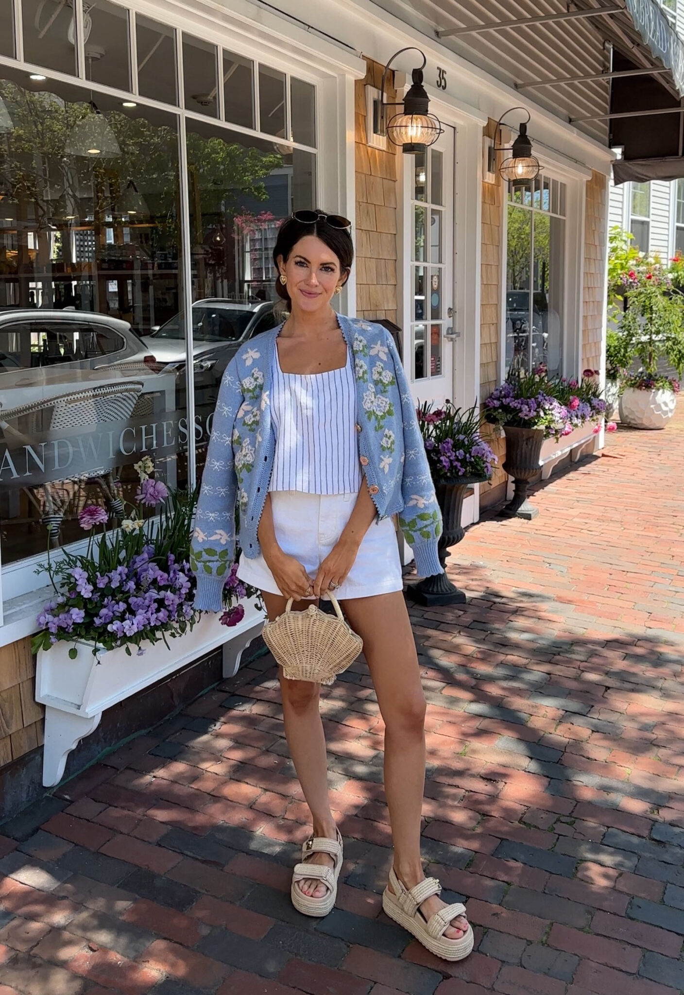 Summer outfit inspo!
Summer fashion, summer style, white shorts, striped tank, floral cardigan, shell handbag, Amazon sunglasses, Steve Madden sandals 

#LTKfindsunder100 #LTKfindsunder50 #LTKSeasonal
