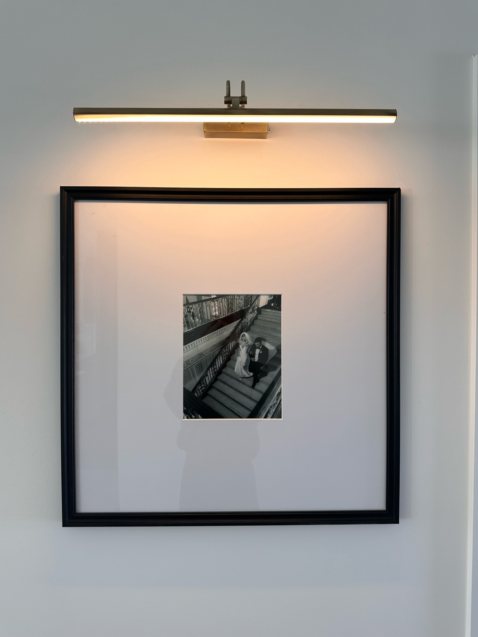 This photo light completely ELEVATES this photo frame. 

So easy to install. I love that the picture light has a warm yellow light making it extra cozy with lamps on at night. 

Highly recommend!!! 

Photo light details: 20 inch, antique brass  (also available in 13 in and 16 in)

Frame is from home goods, but I linked similar! 

Home decor. Living room decor. Photo wall. Photo gallery. Black picture frame. Hallways decor. 

#LTKFindsUnder50 #LTKHome