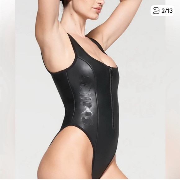 Sw1. Skims rubberized scuba swim scoop neck zip front one piece onyx medium NWT | Poshmark